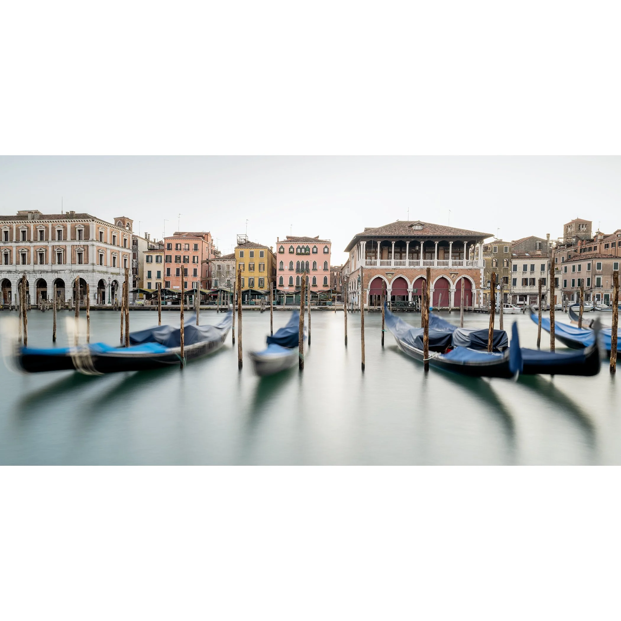 © 2025 Gerald Berghammer - Color cityscape photography. Gondolas docked along a canal in Venice, Italy, with historic buildings and the fish market in the back.