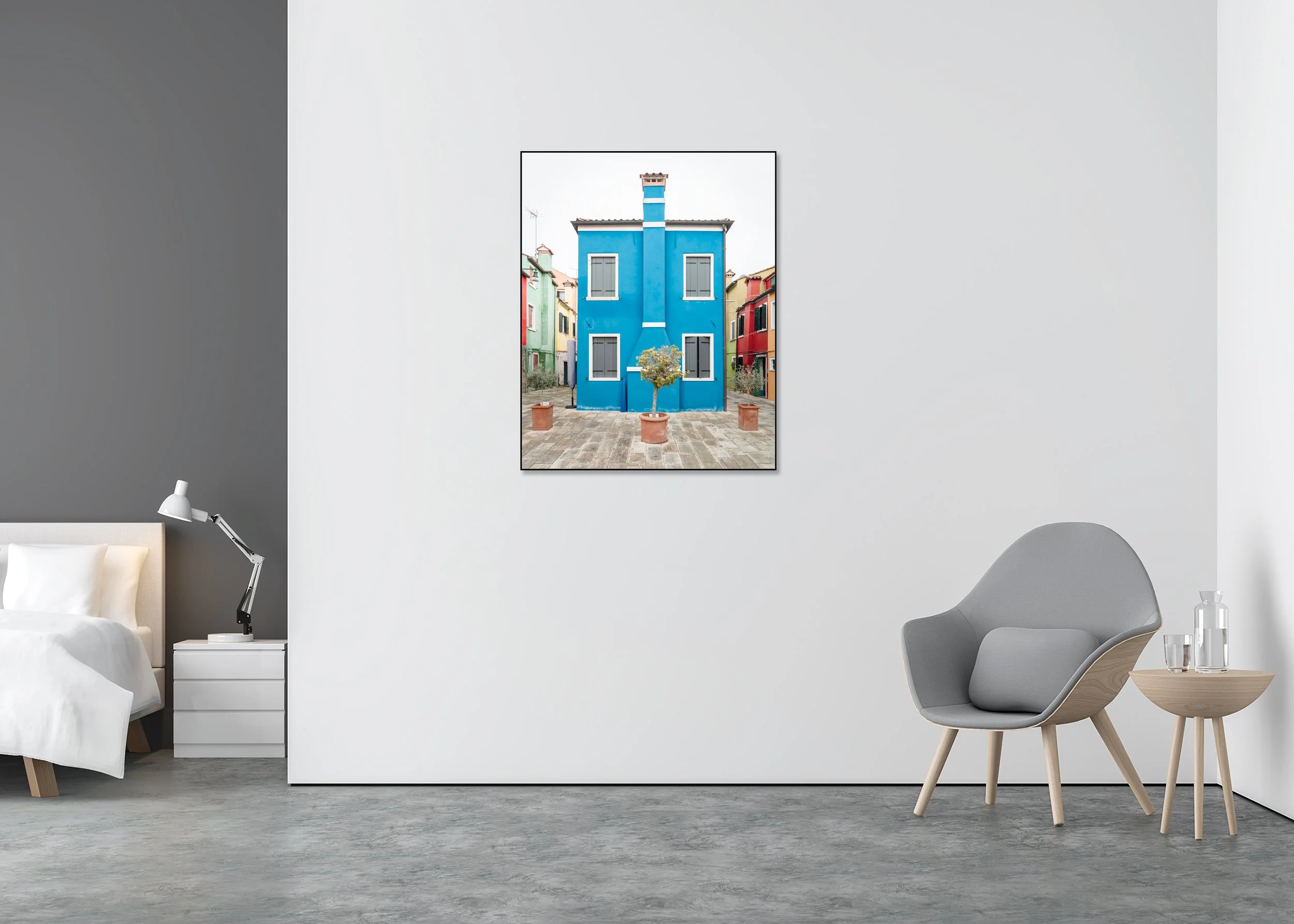 The Blue House displayed in a modern interior, mounted on aluminium Dibond in a black ArtBox frame by Gerald Berghammer.