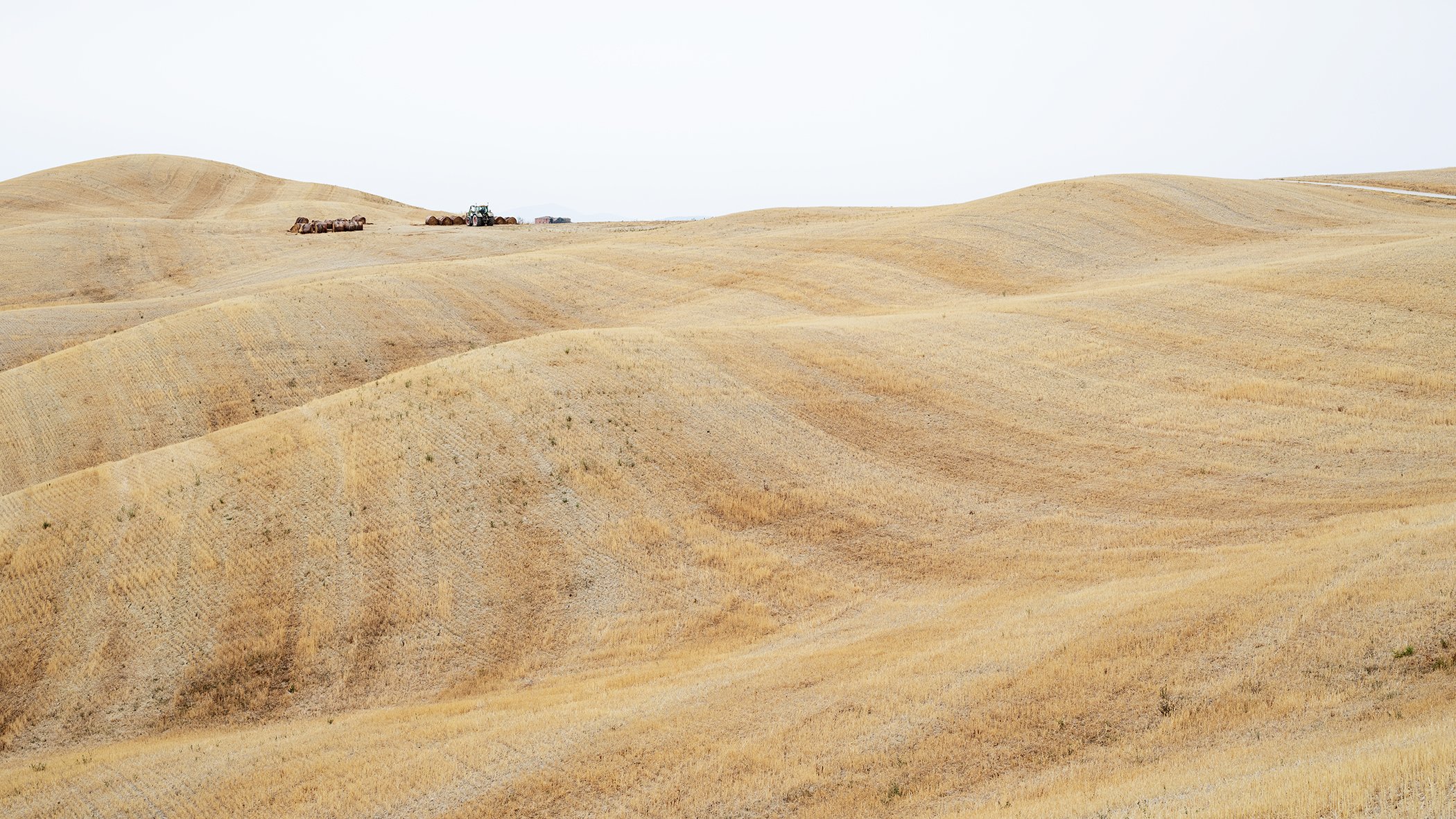 Rolling Hills Study 1 by Gerald Berghammer, minimalist colour landscape photograph of harvested rolling hills in Tuscany, Italy.