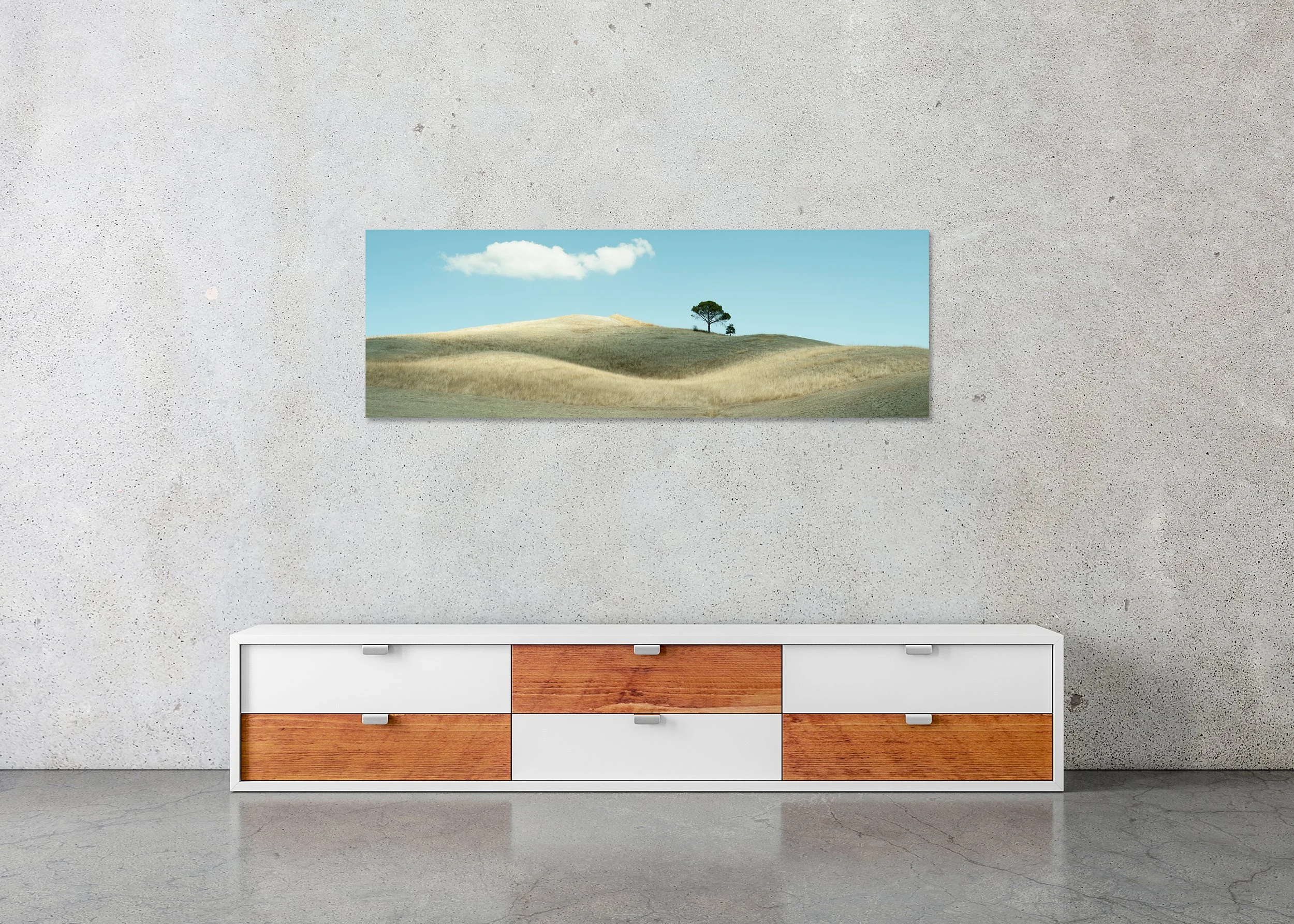 Lonely Tree and Rolling Hills displayed in a modern interior as a frameless colour aluminium Dibond print by Gerald Berghammer.