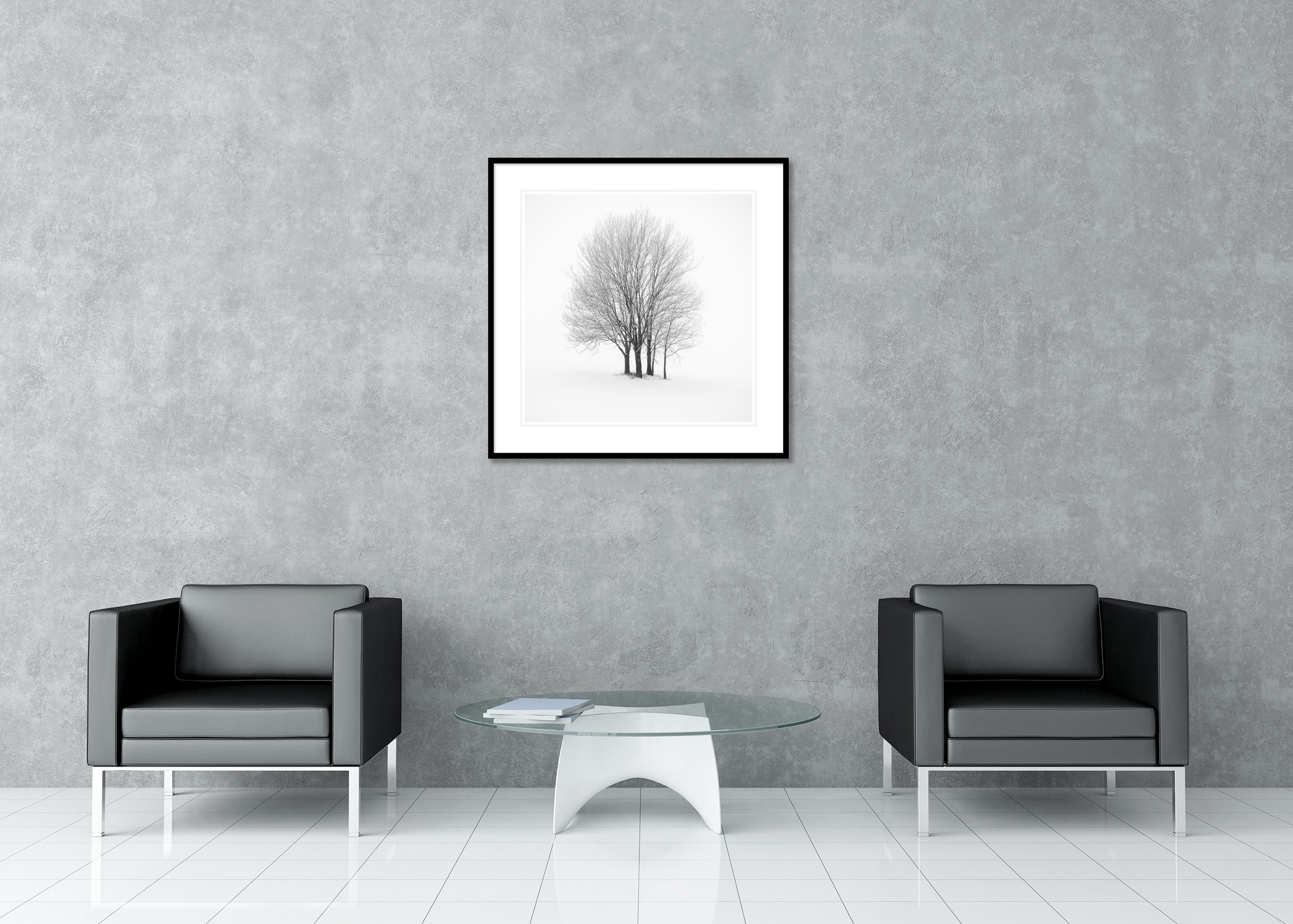 Five Minimalist Winter Trees in the Snow – Austria displayed in a modern interior as an archival pigment print in a black aluminium frame with a white mount by Gerald Berghammer.