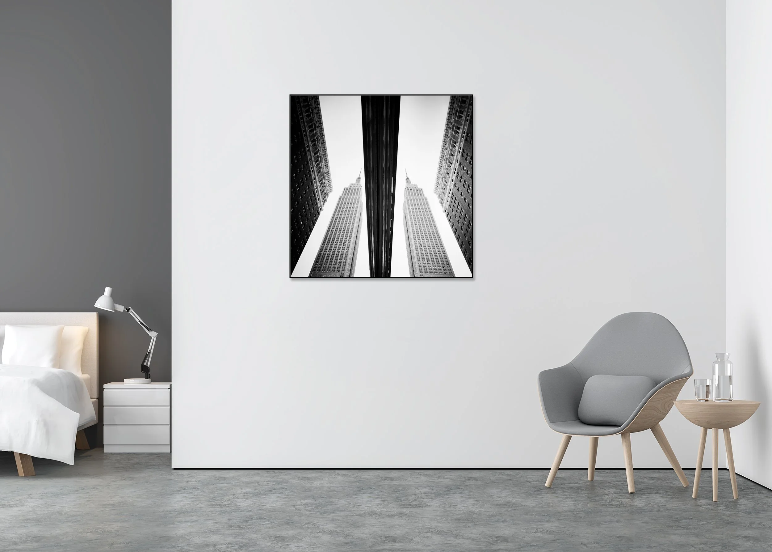 Black-and-white photo of the Empire State Building reflected symmetrically in a New York City shop window, mounted on Dibond in an aluminium ArtBox.