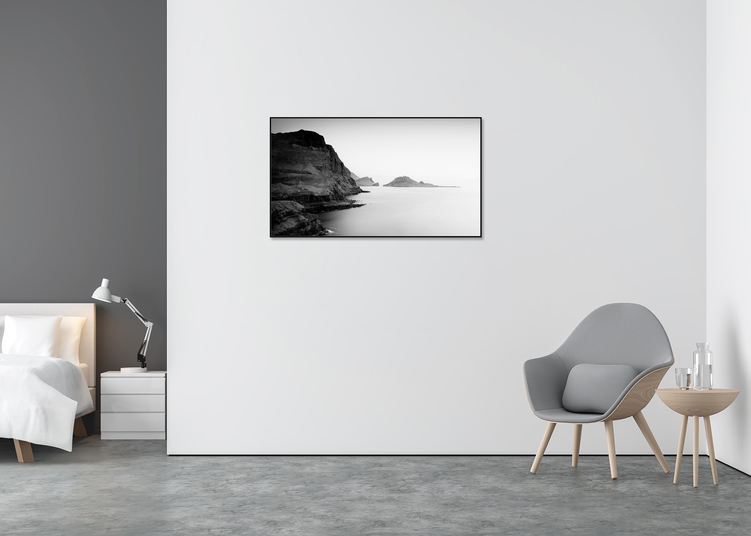 Rugged seaside cliffs and layered rock islands in a calm ocean, black and white photo print mounted on Dibond in an aluminium ArtBox.