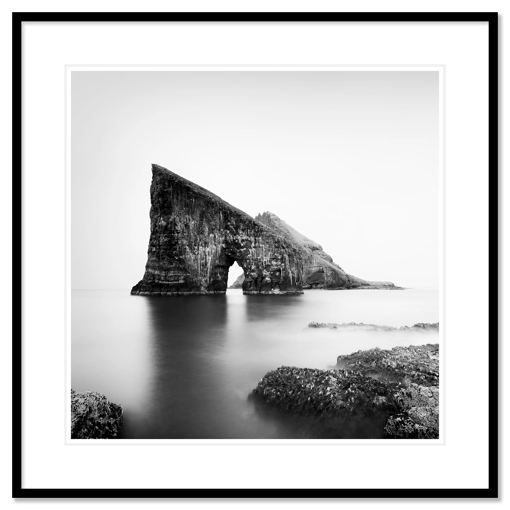 Drangarnir Sea Stacks Study 2 by Gerald Berghammer in a black aluminium frame with a white mount.
