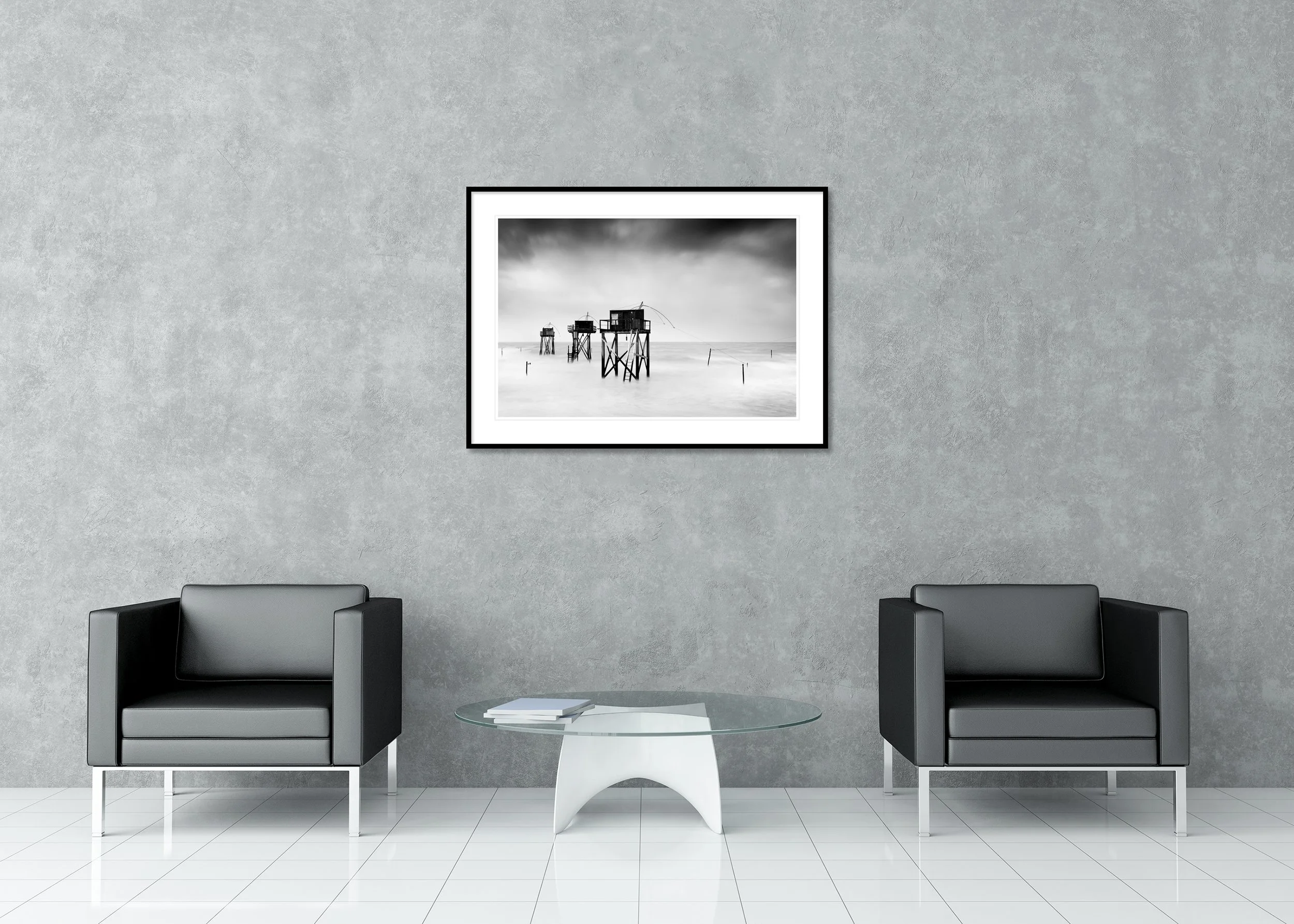 Minimalist monochrome long-exposure seascape with stilted wooden fishing huts and a smooth, misty sea, archival pigment print in a classic frame with mount.