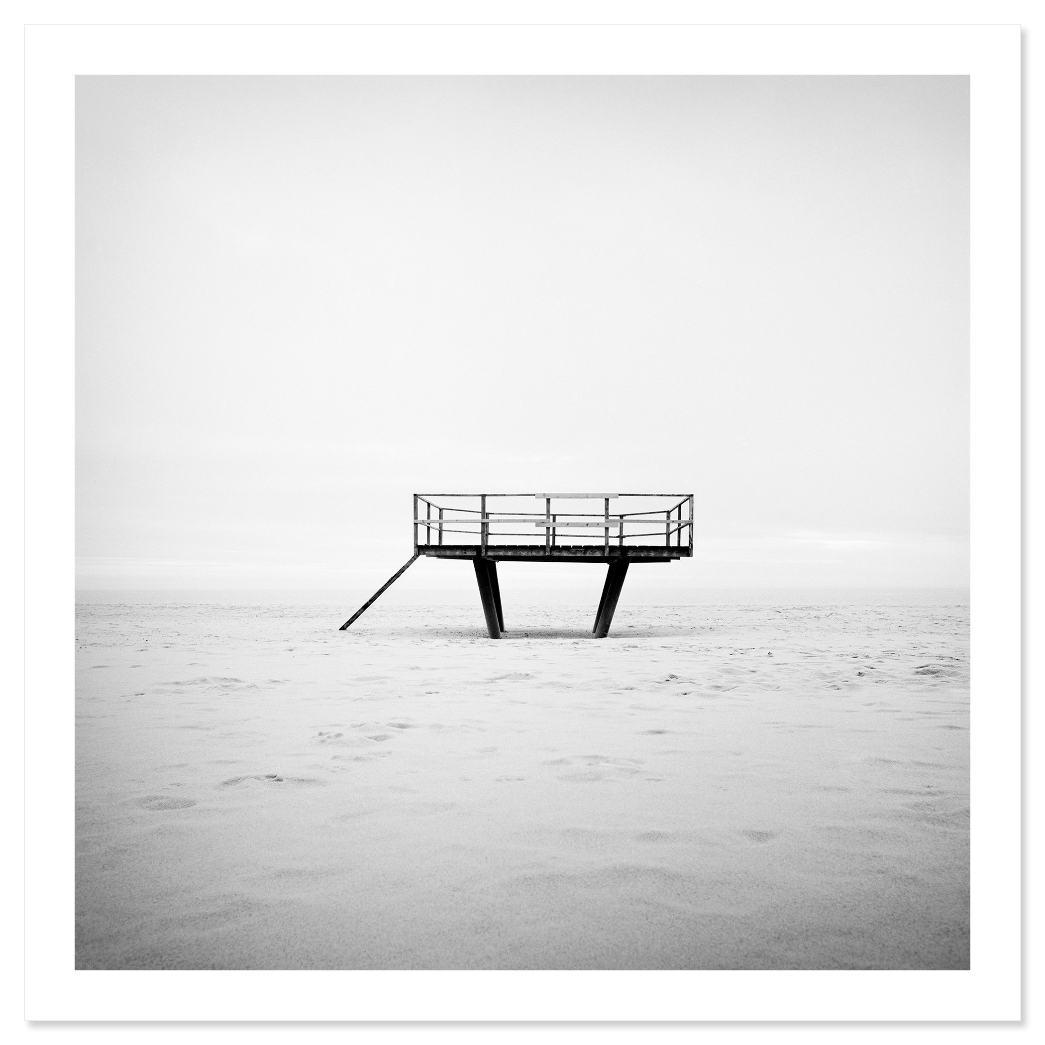 Dance Floor – black-and-white fine art photograph of an elevated platform on Sylt, shown as an archival pigment print with a white border by Gerald Berghammer.
