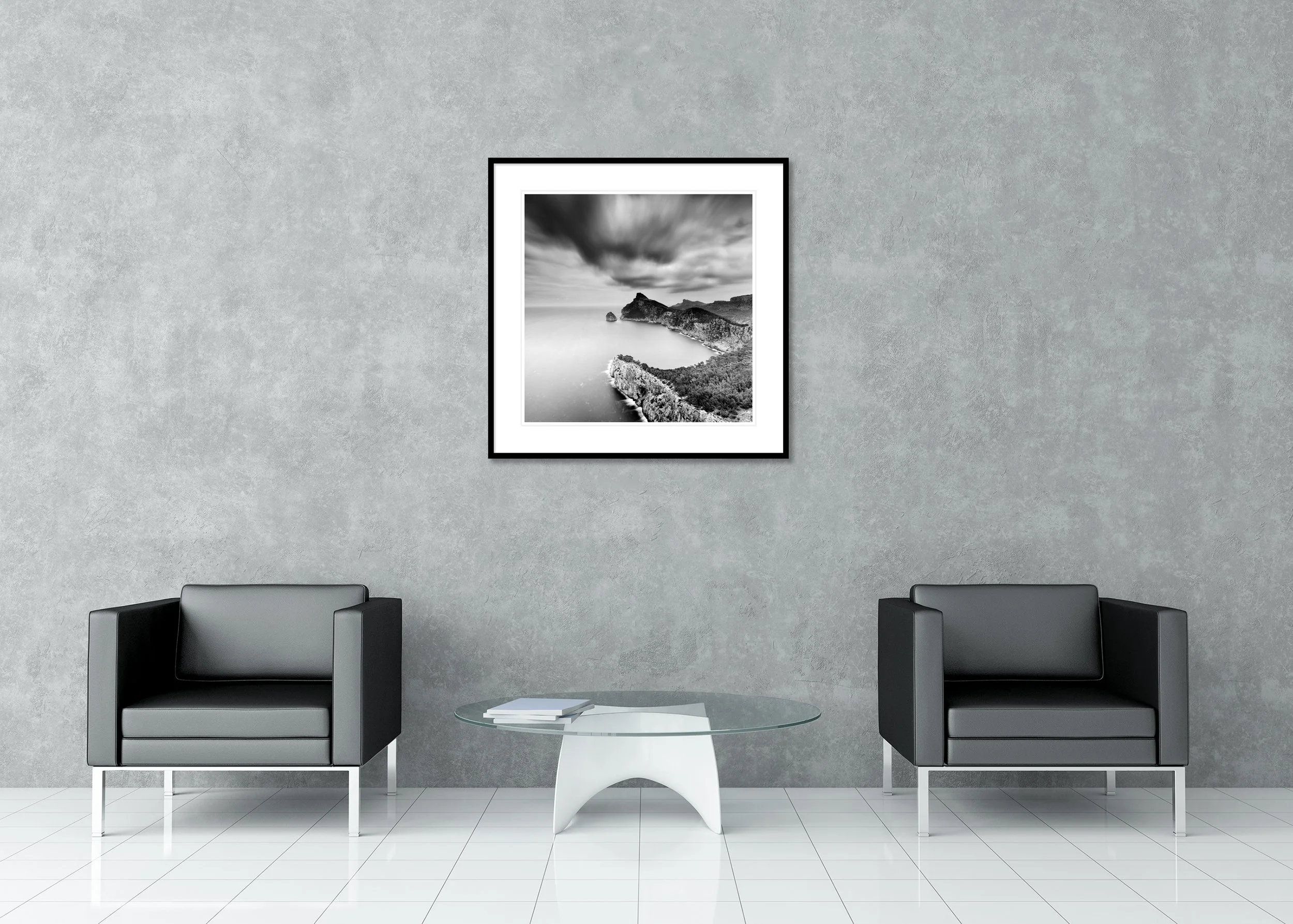 Black-and-white long-exposure coastal scene on archival pigment print in classic frame with passe-partout, rugged sea cliffs, calm ocean, blurred clouds.