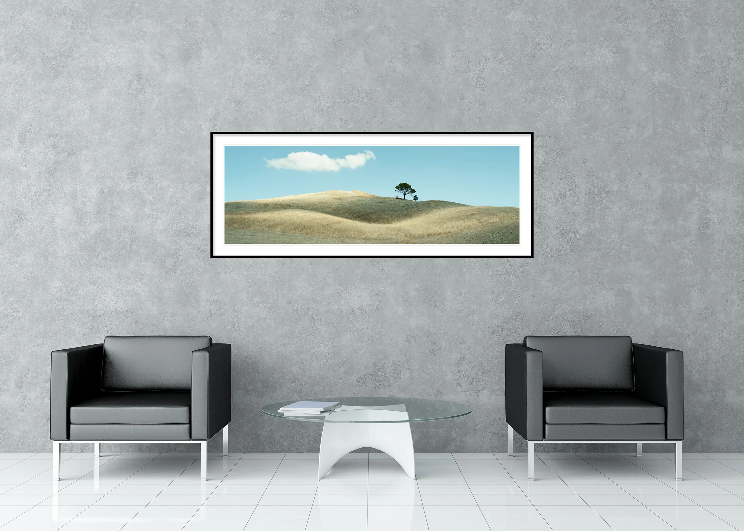 Archival pigment print of rolling golden hills in Tuscany with a lone tree under a bright blue sky, in a classic frame with a mount