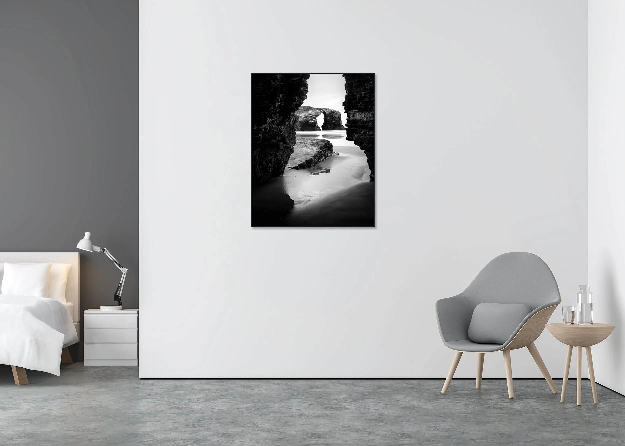 Black and white coastal landscape with rocky shore and natural arch, viewed through a narrow rock opening; ChromaLuxe metal print in Aluminium ArtBox frame.