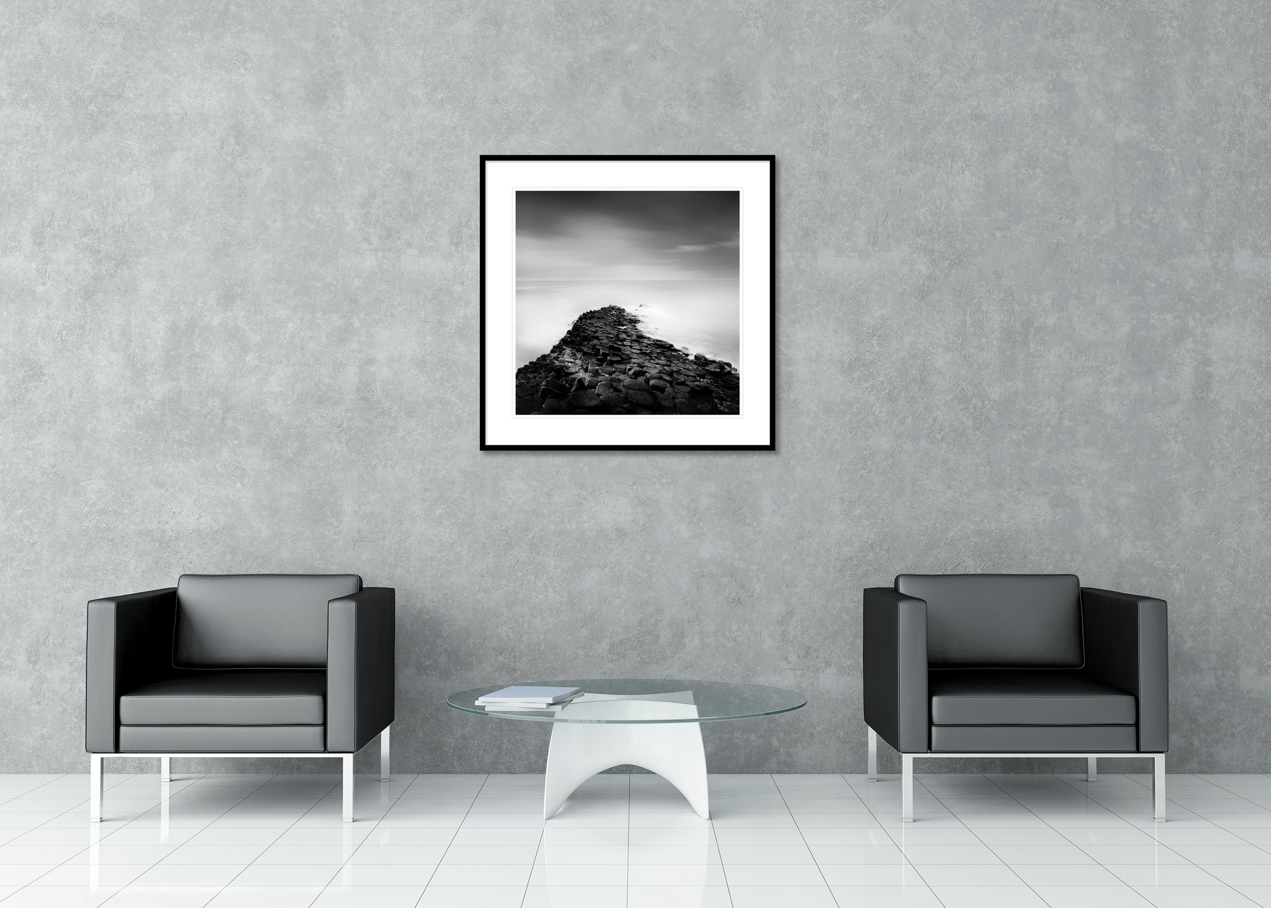 Giant’s Causeway Study 2 displayed in a contemporary interior in a black aluminium frame with a white mount by Gerald Berghammer.