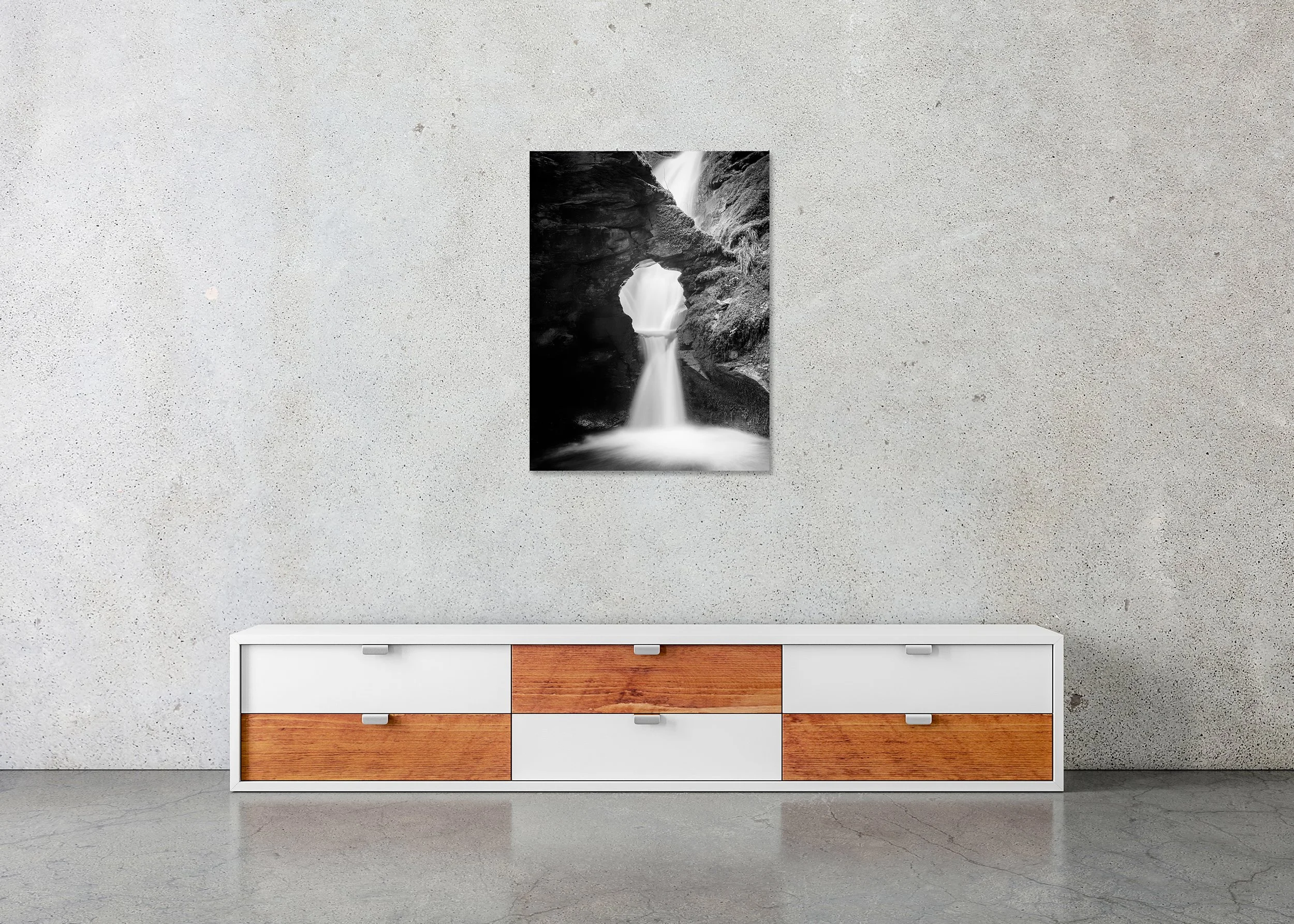 Long exposure black and white waterfall wall art with natural rock opening and soft flowing water, photo print mounted on Dibond, frameless