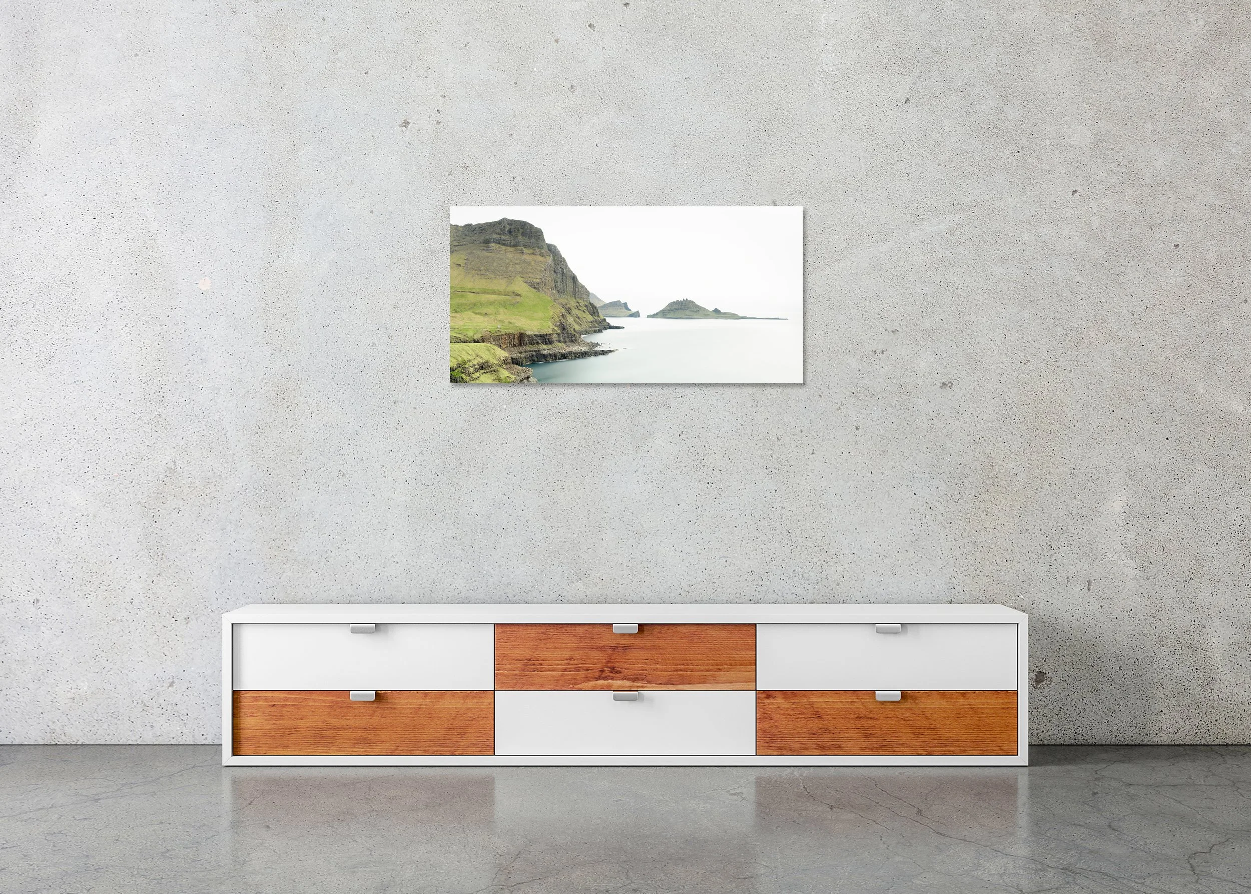 Sea Cliffs, Panorama Study 2 – frameless colour photograph on aluminium Dibond displayed above a low cabinet.