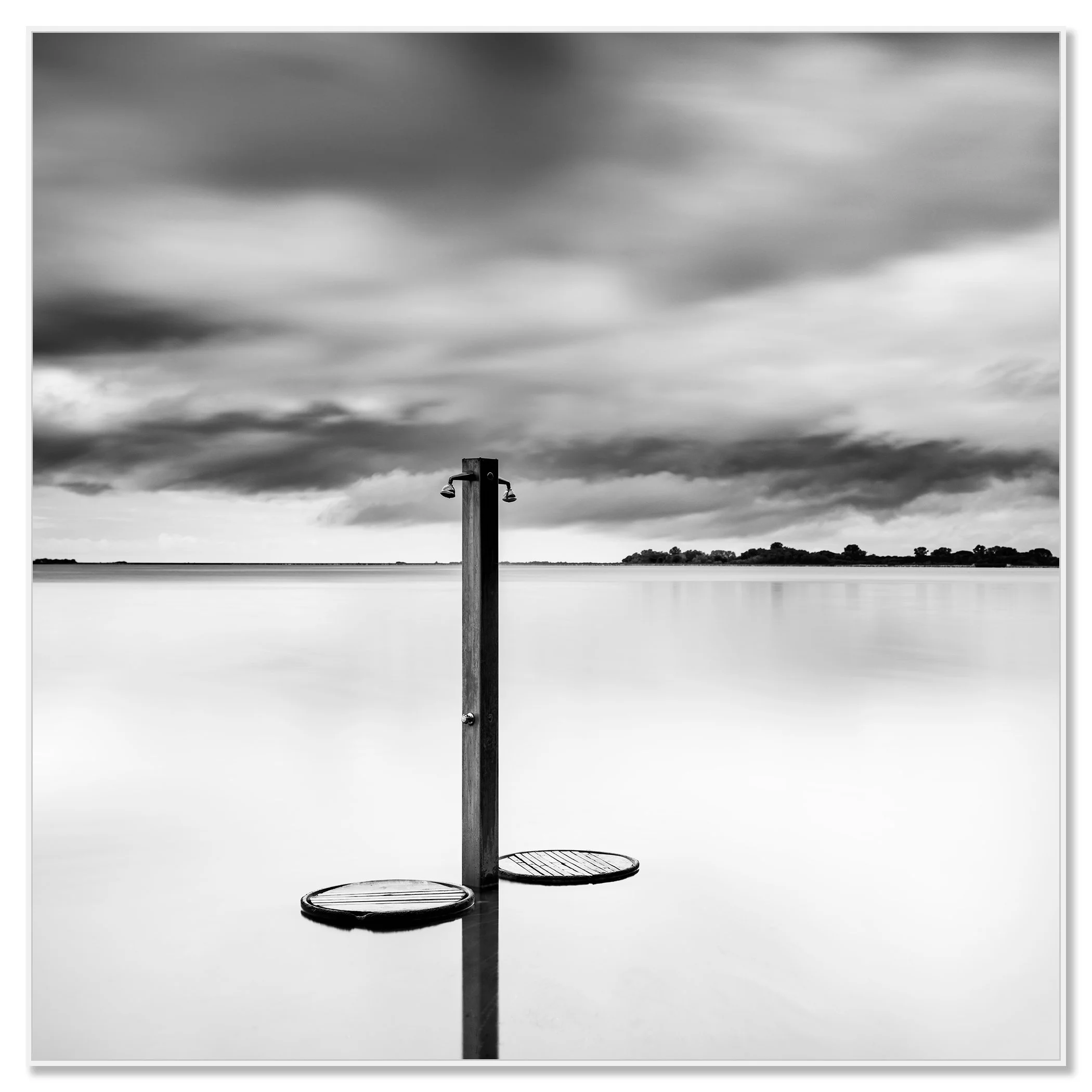 Beach Shower in a Storm – black-and-white fine art photograph mounted on aluminium Dibond in a white ArtBox frame by Gerald Berghammer.