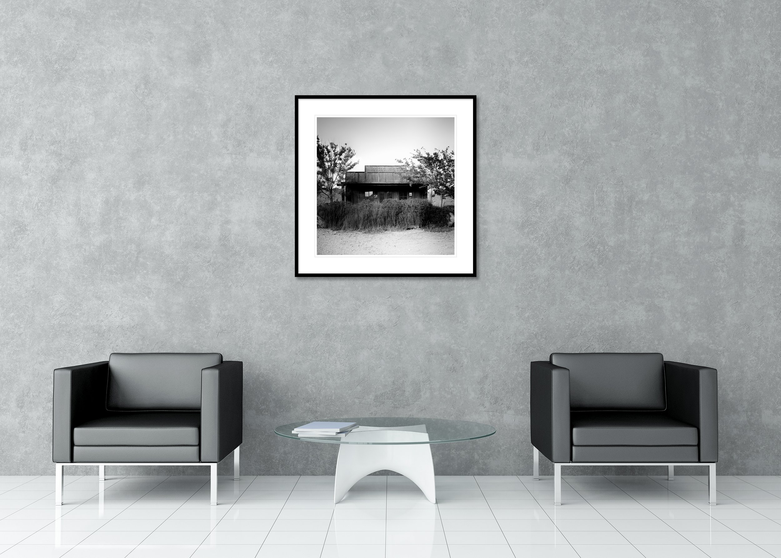 Music Hall – Arizona, archival pigment print in a black aluminium frame with white mount, displayed in a modern lounge