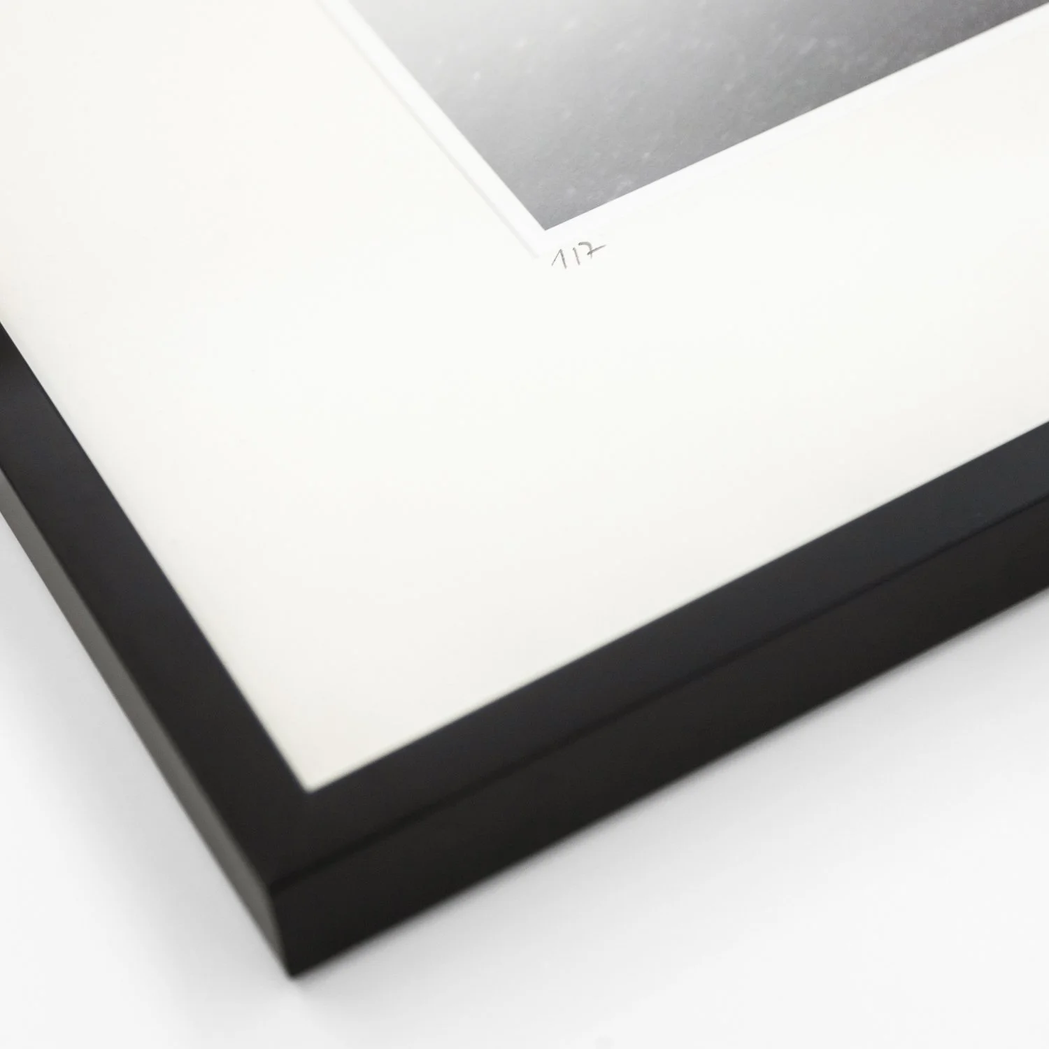 Detail of the handwritten edition number 1/7 on the white archival mount of Mirador Es Colomer Study 1 by Gerald Berghammer.