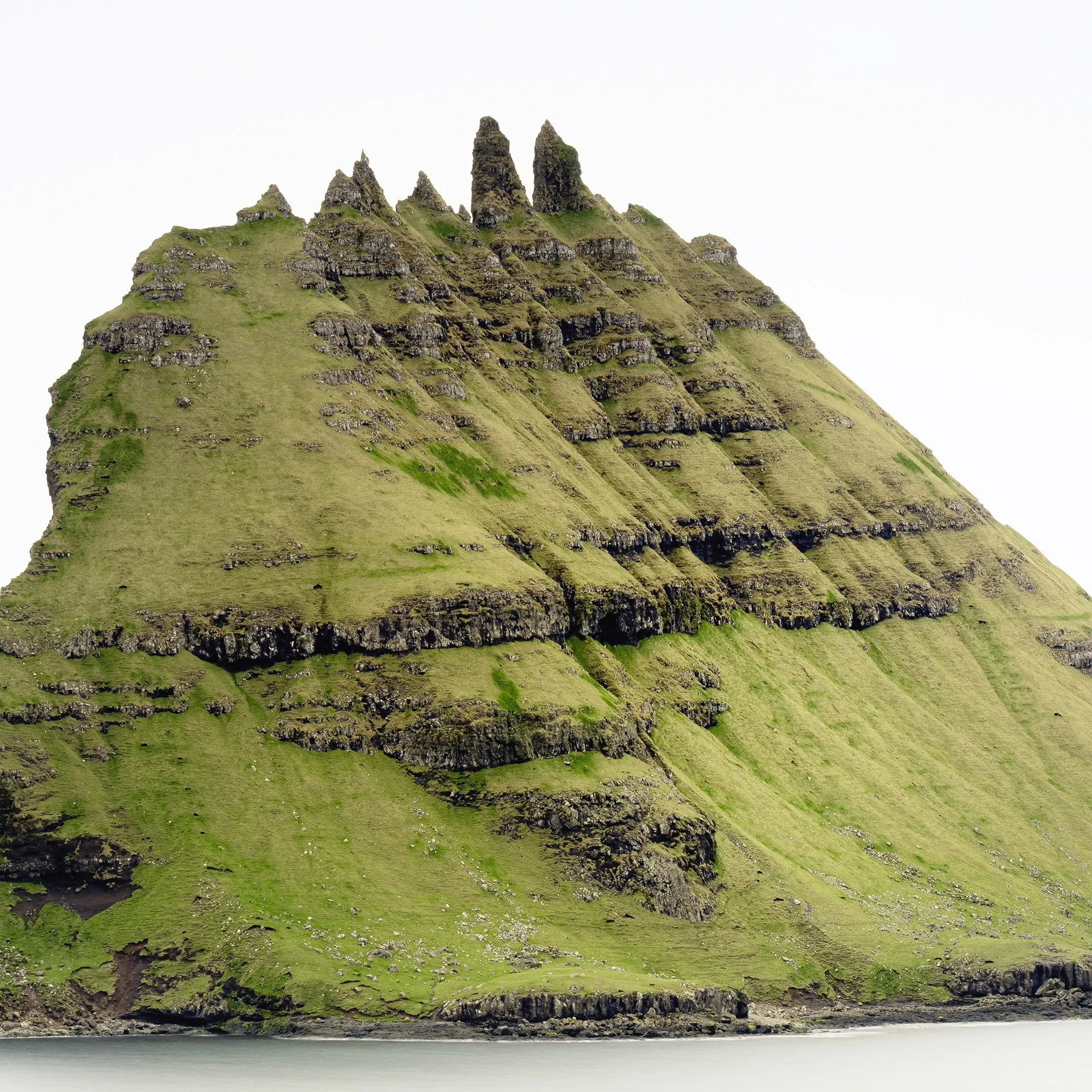 Cropped detail of Green Rock Island – Faroe Islands colour fine art print showing the island and calm sea