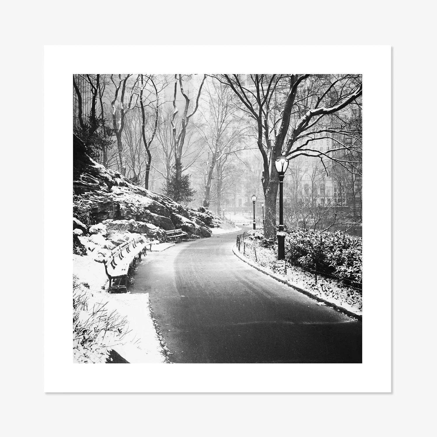 Black-and-white fine art print of a snow-covered pathway in Central Park, New York City, by Gerald Berghammer.