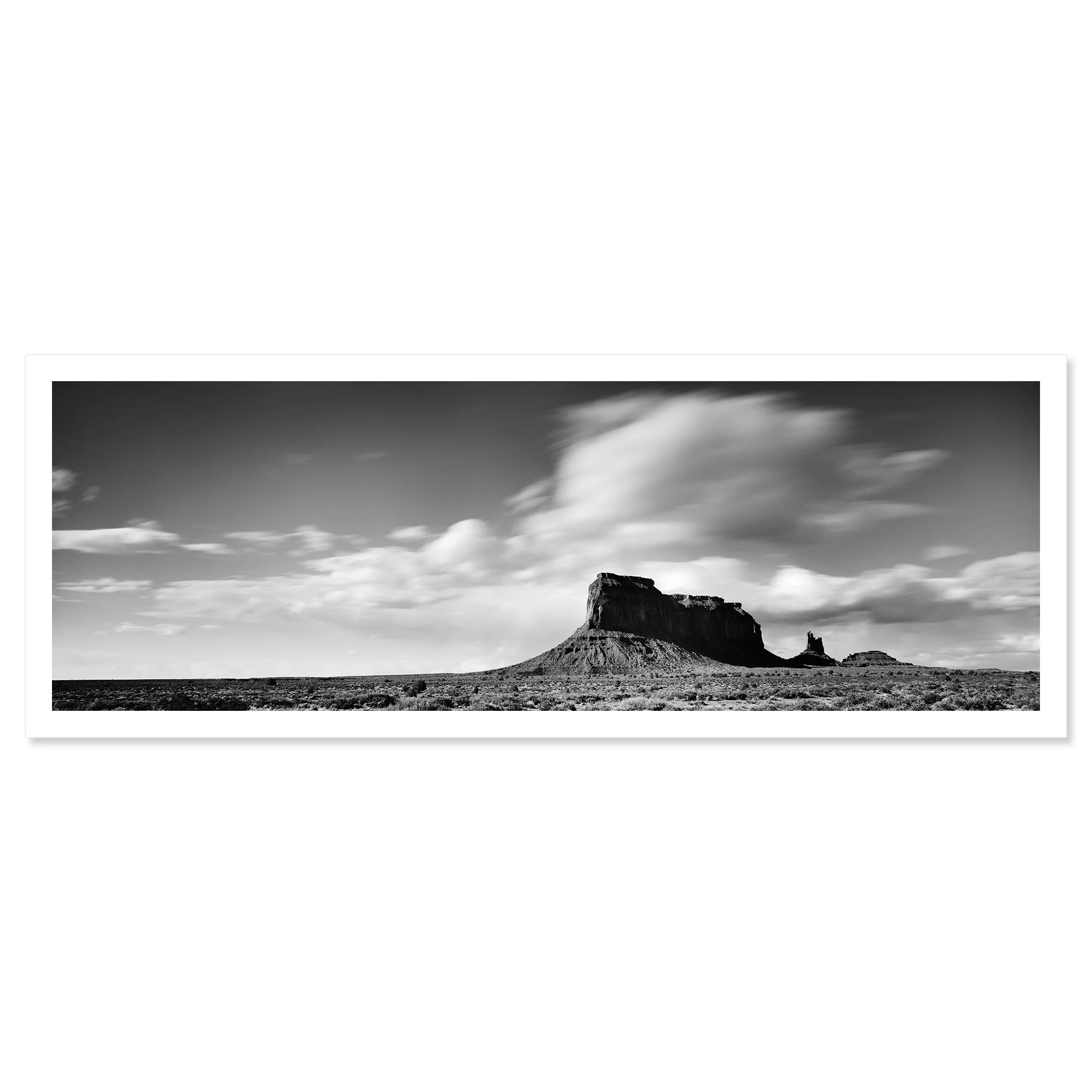 Gerald Berghammer - Black and white panorama desert photography. Flat-topped mesa with a smaller rock formation nearby, under a sky with scattered clouds. Fine art print only