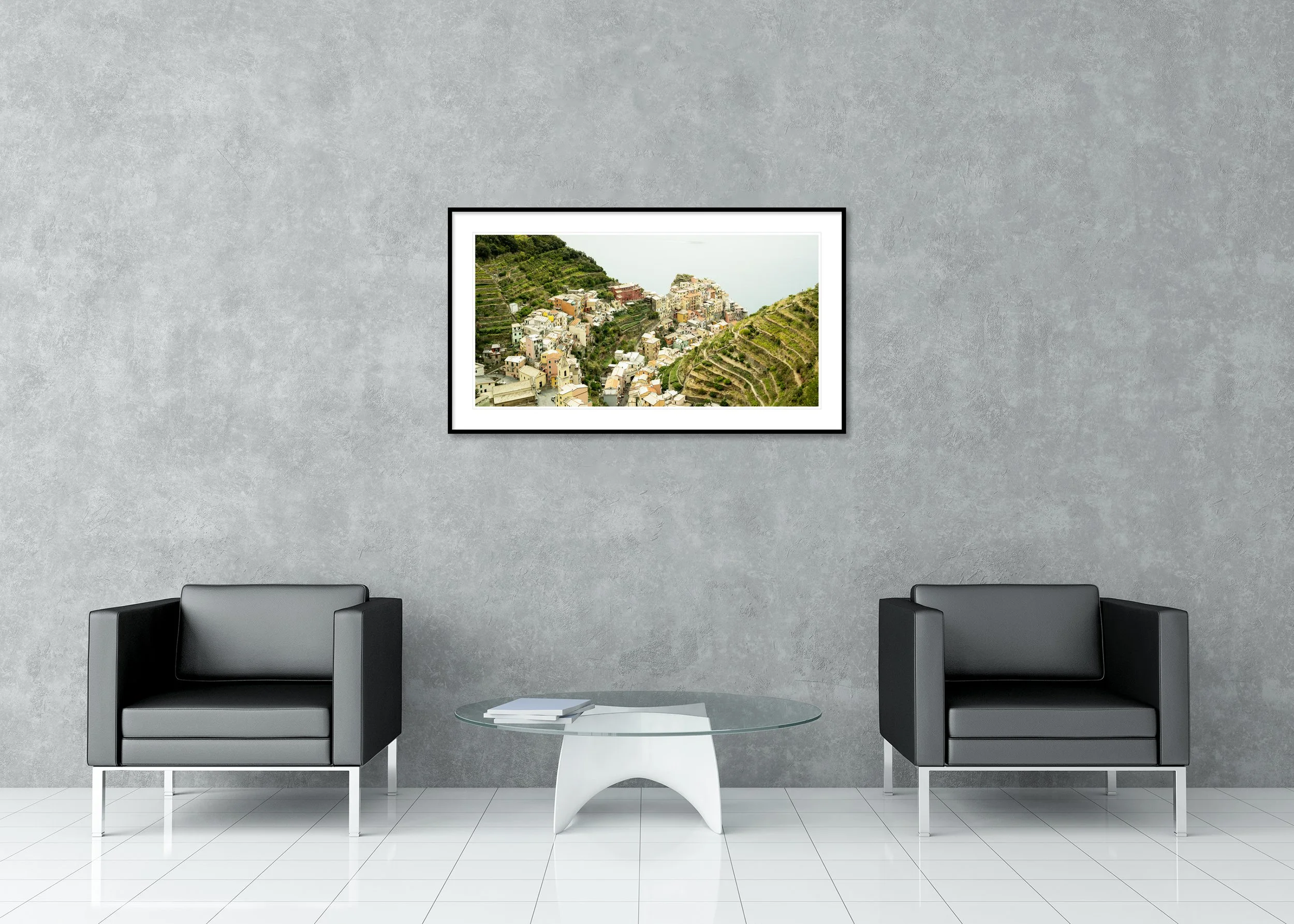 Picturesque Village Study 2 displayed in a modern interior as an archival pigment print in a black aluminium frame with white mount by Gerald Berghammer.