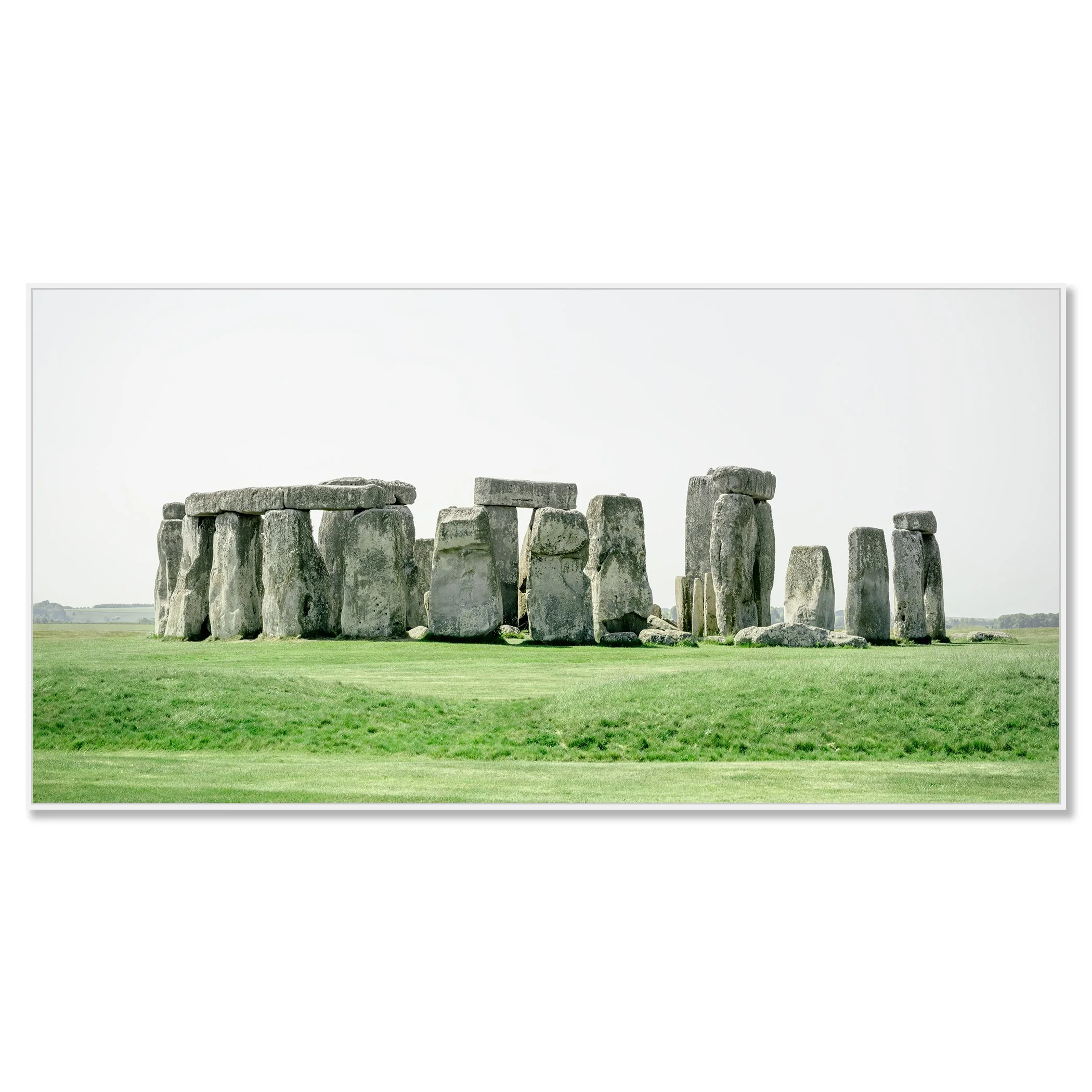 Gerald Berghammer - Color landscape panorama photography. Historic Stonehenge monument with large standing stones on a grassy field under a gray sky. Chromaluxe framed white