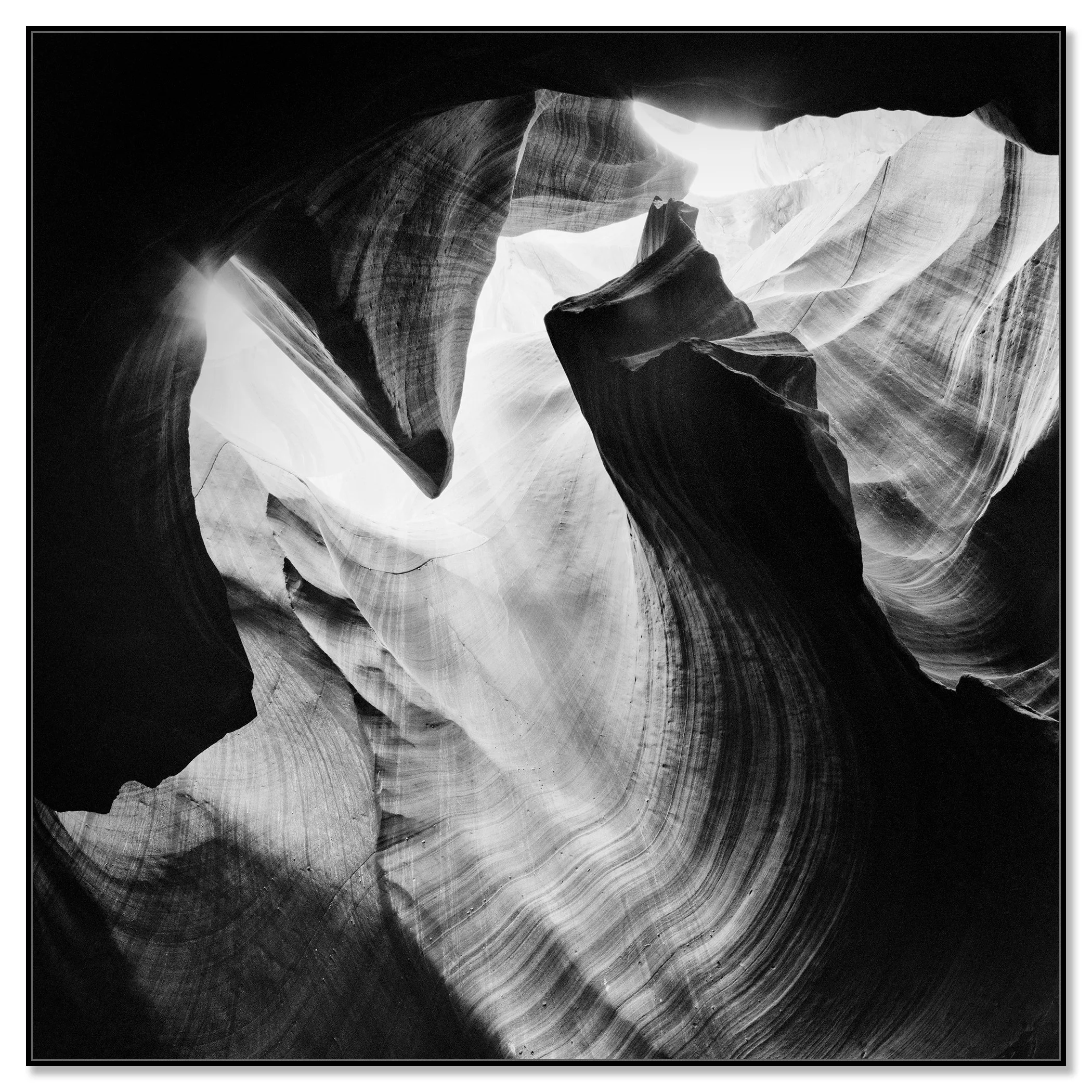 Antelope Canyon Study 4 displayed as a black-and-white Dibond print in a black aluminium ArtBox frame by Gerald Berghammer.
