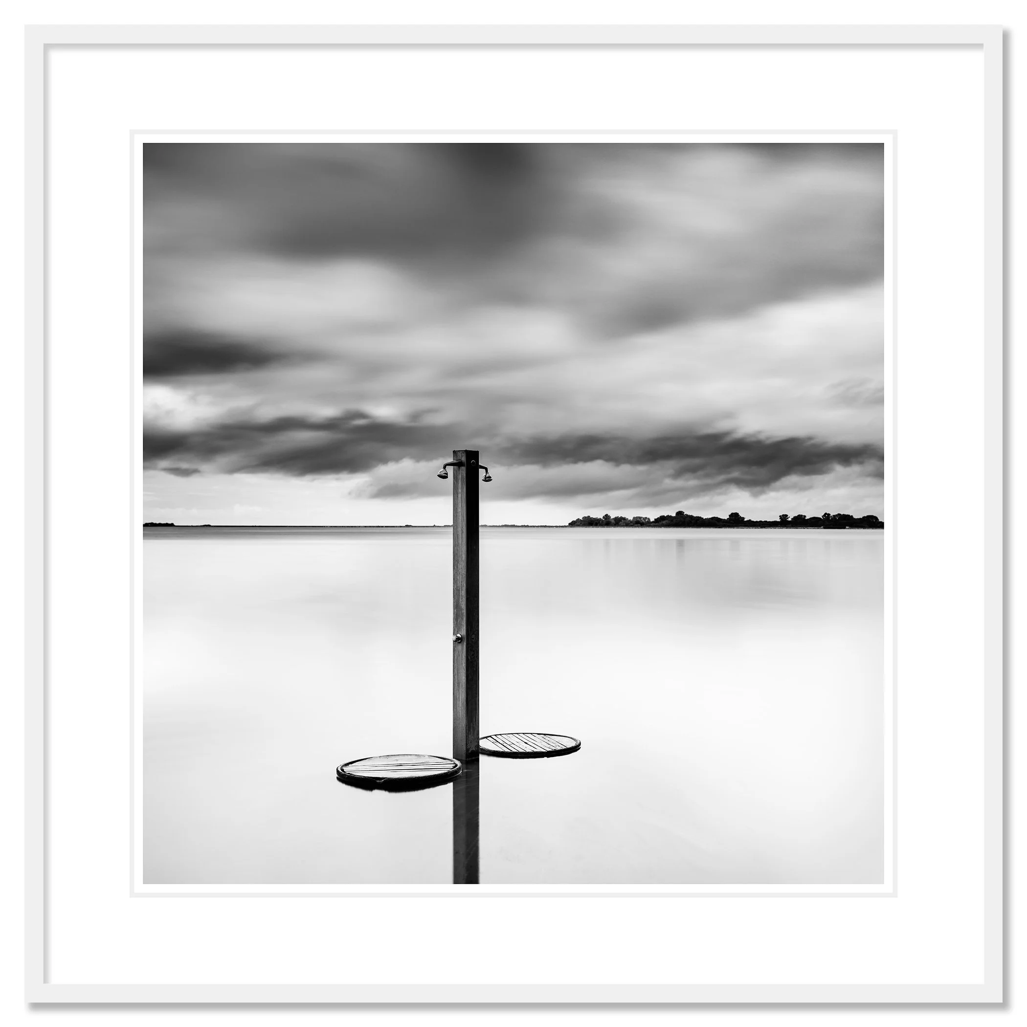 Beach Shower in a Storm – archival black-and-white fine art print in a white aluminium frame with a white mount by Gerald Berghammer.