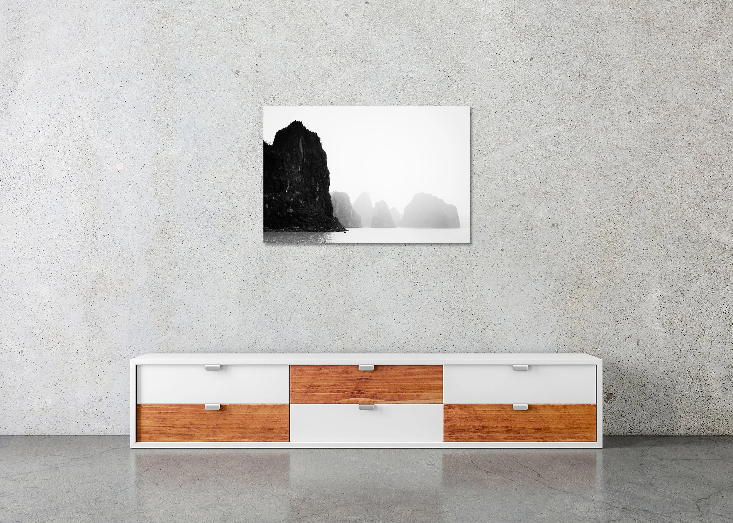 Karst limestone islands rising from the sea with a misty background and muted overcast sky, photo print mounted to Dibond, frameless.