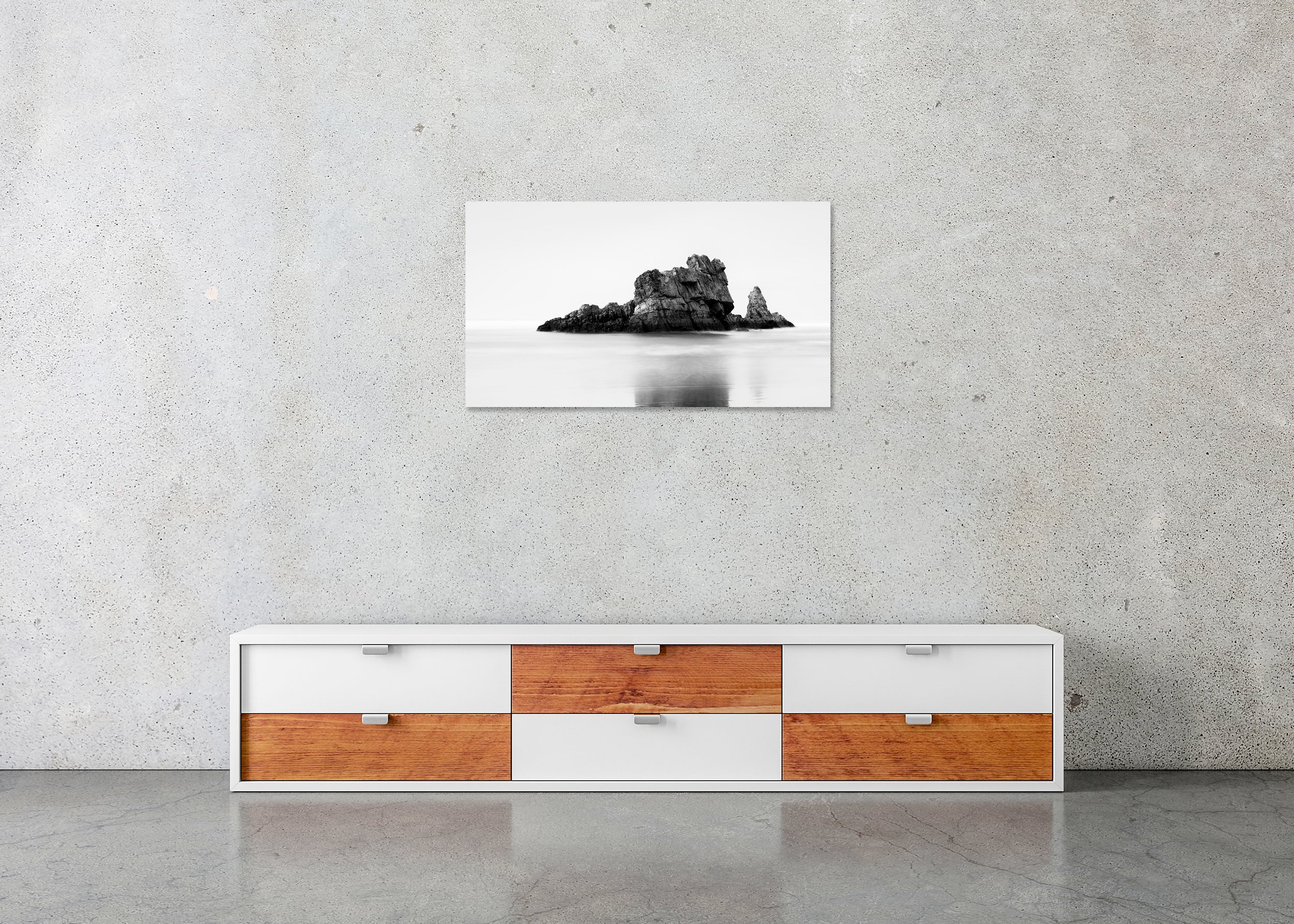 Rock on the Beach Panorama Study 1 displayed in a modern interior as a frameless black-and-white artwork mounted on aluminium Dibond.