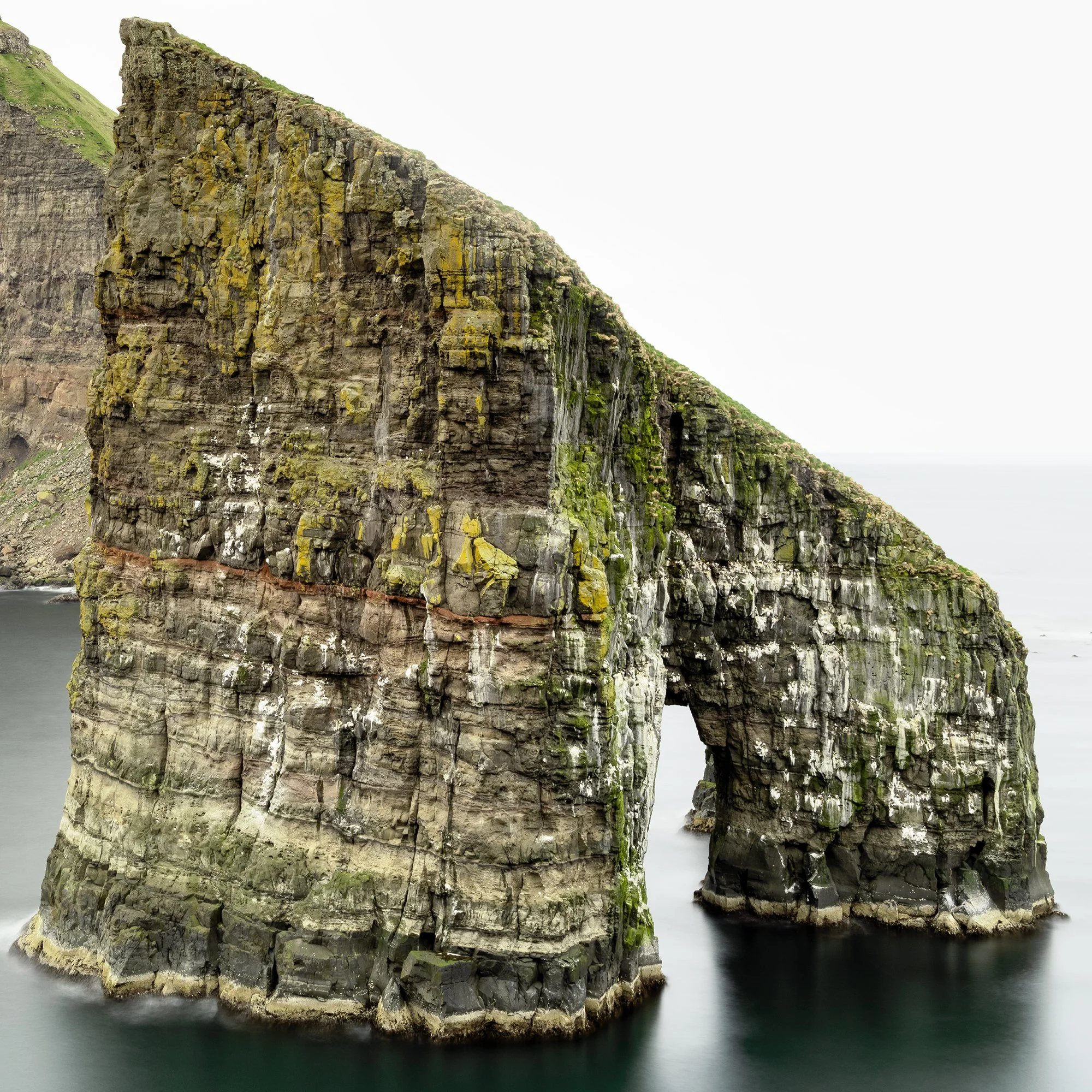 Detailed view of the Drangarnir sea arch rock formation in Gerald Berghammer’s Faroe Islands photograph