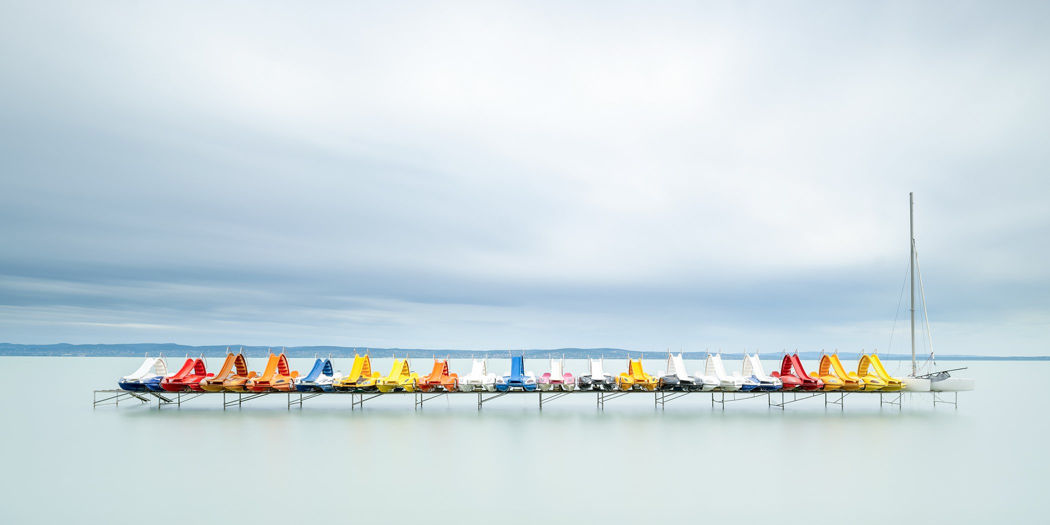 Pedal Boats and a Catamaran, panoramic colour fine art photograph of Lake Balaton, Hungary, by Gerald Berghammer.