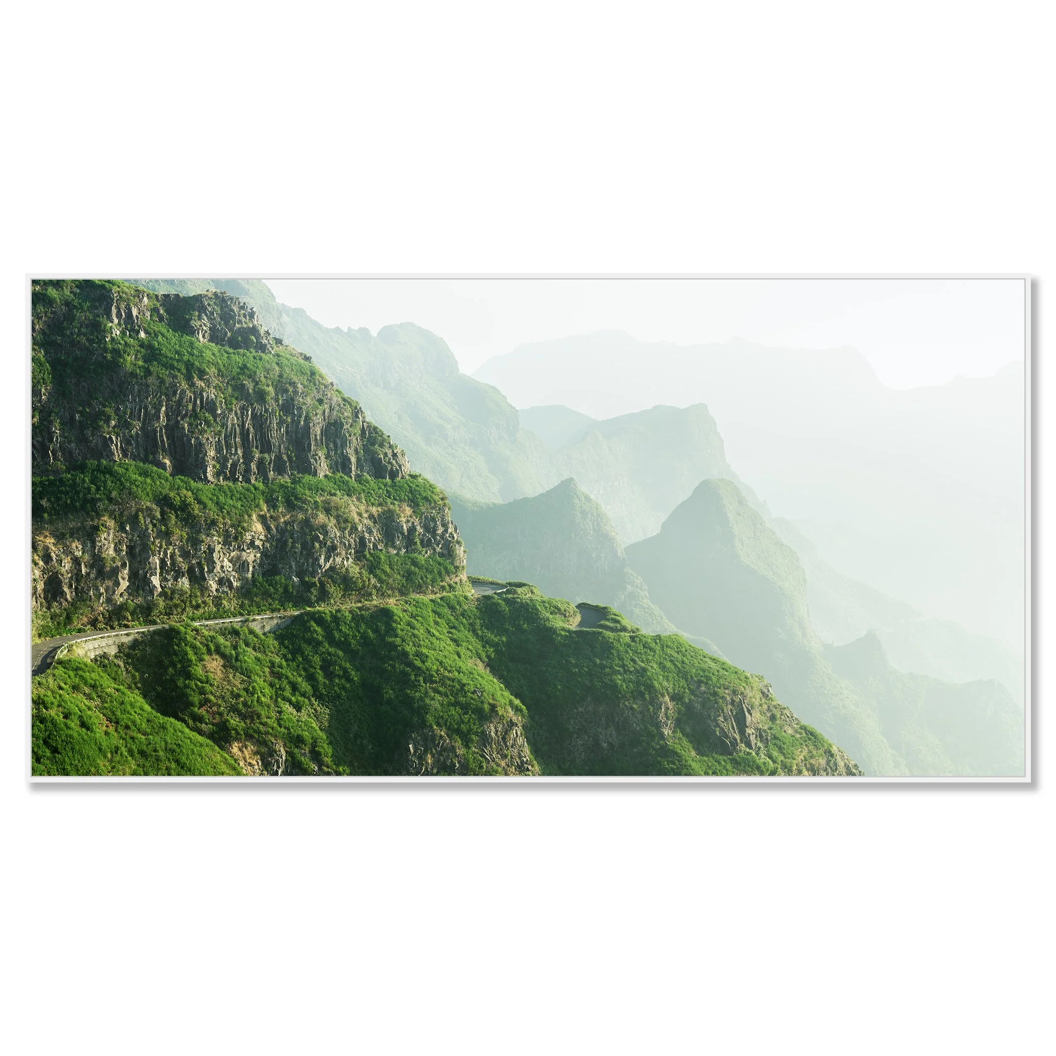 © 2021 Gerald Berghammer - Color Fine Art Landscape Photography. A winding mountain road through lush green cliffs and misty mountains in the background. Chromaluxe framed white