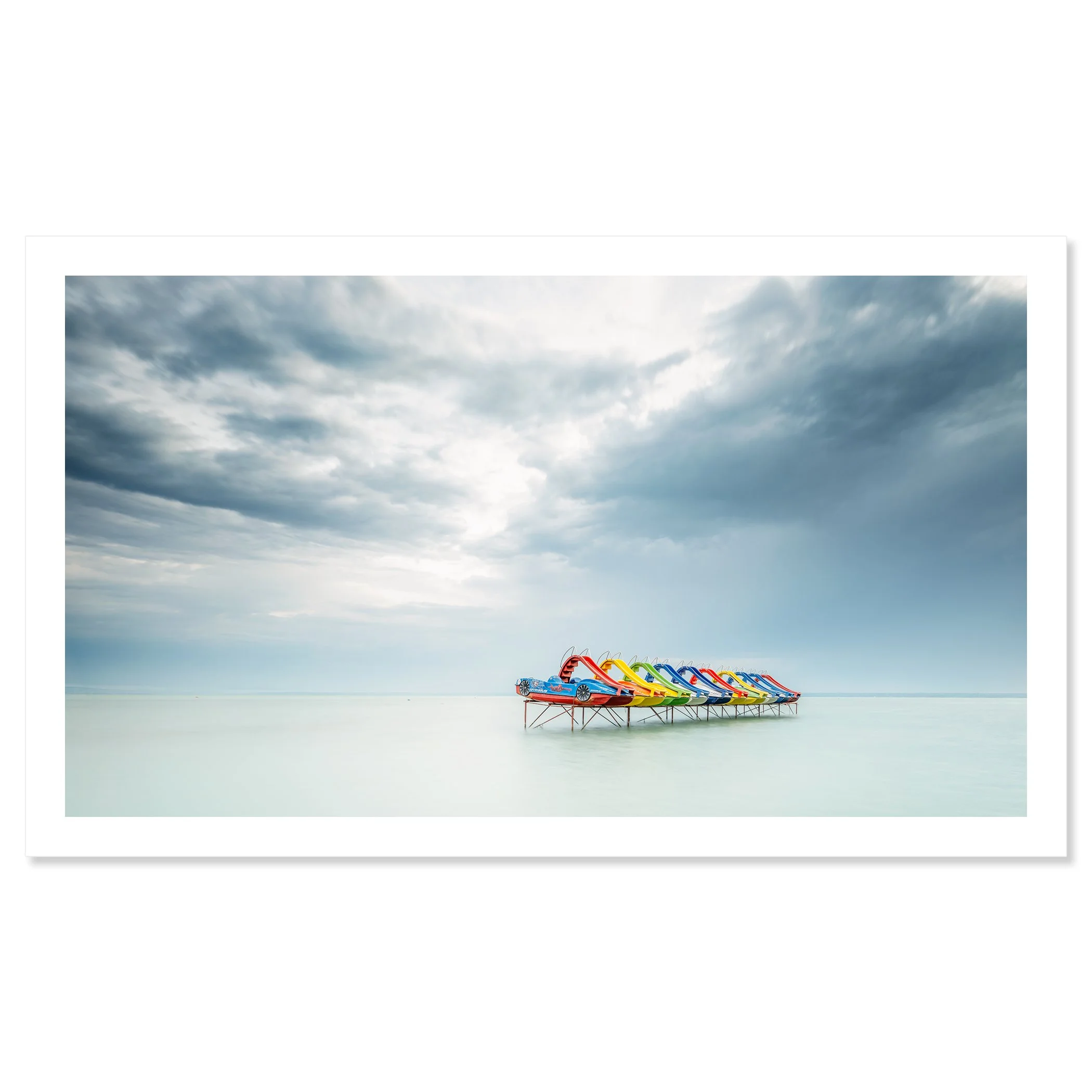 © 2021 Gerald Berghammer - Color panorama waterscape photography. A row of colorful pedal boats on the lake Balaton with dramatic cloudy sky. Fine art print only