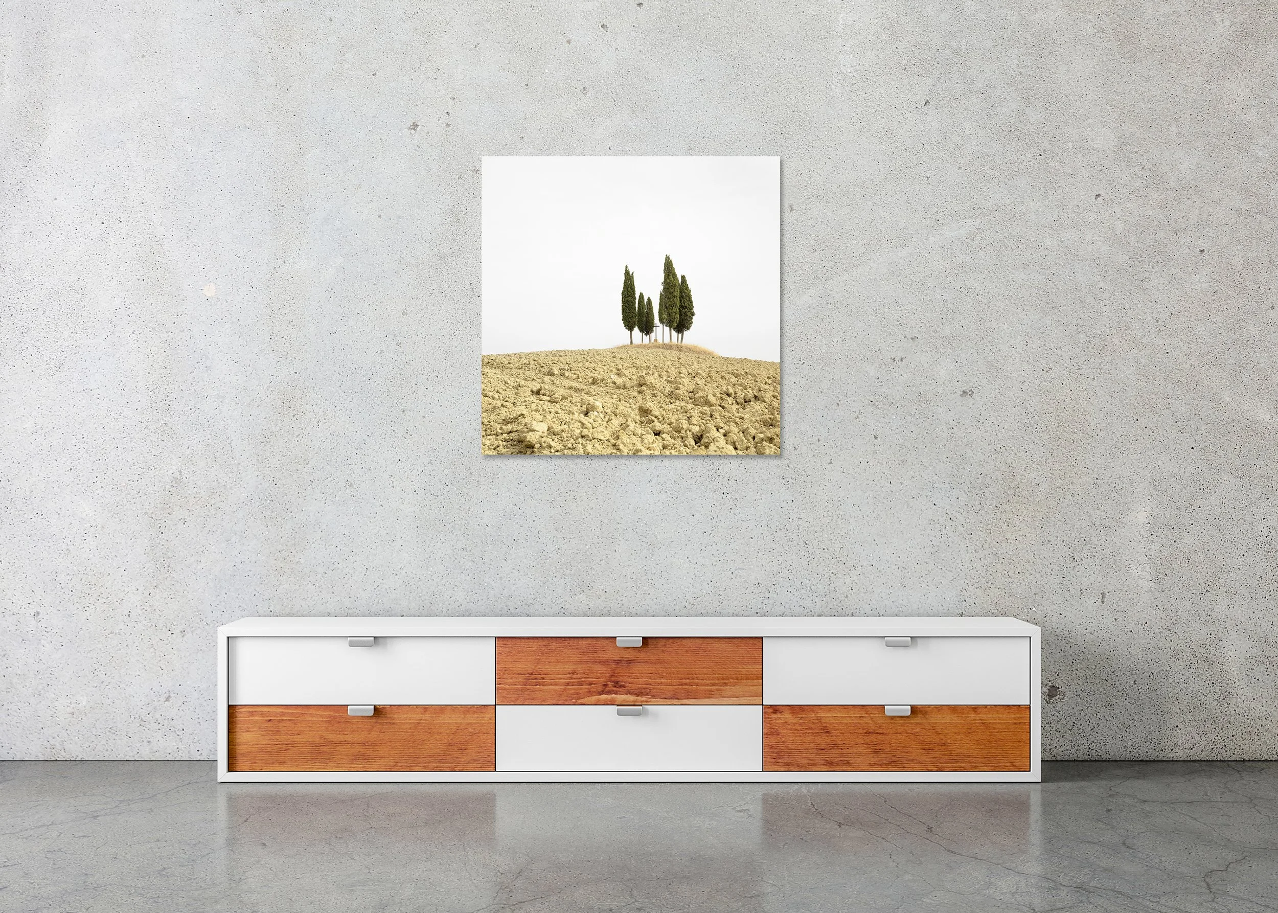 Cypress Tree on a Hill with a Cross displayed in a modern interior as a frameless colour artwork mounted on aluminium Dibond by Gerald Berghammer.