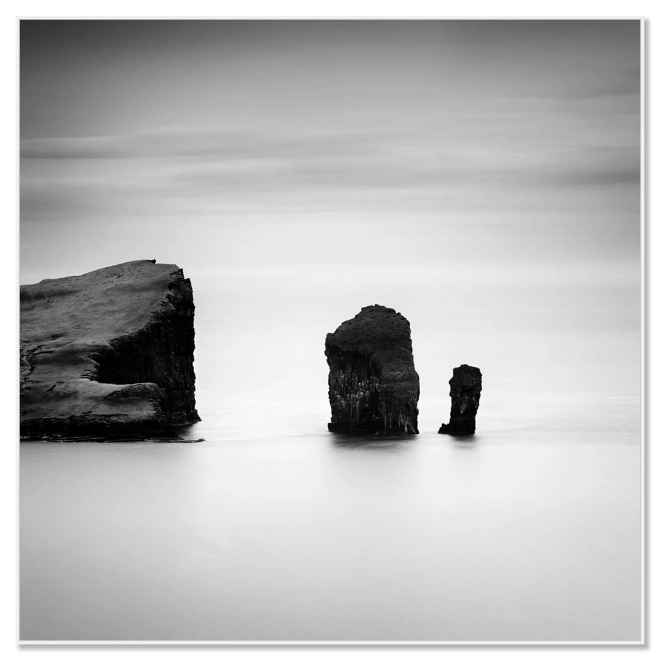 North Atlantic Basalt Study 1 – Faroe Islands, black-and-white photograph in a white aluminium ArtBox frame by Gerald Berghammer.