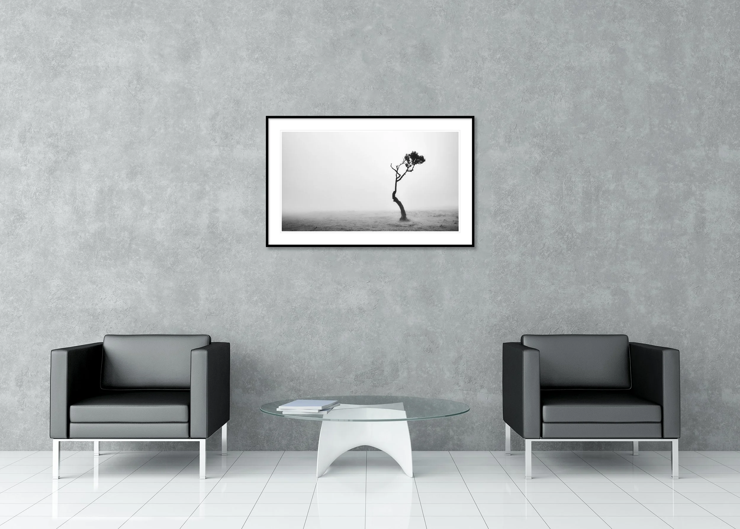 Lonely Tree in the Fog by Gerald Berghammer, black-and-white fine art print in an aluminium frame with white mount displayed in a modern interior.