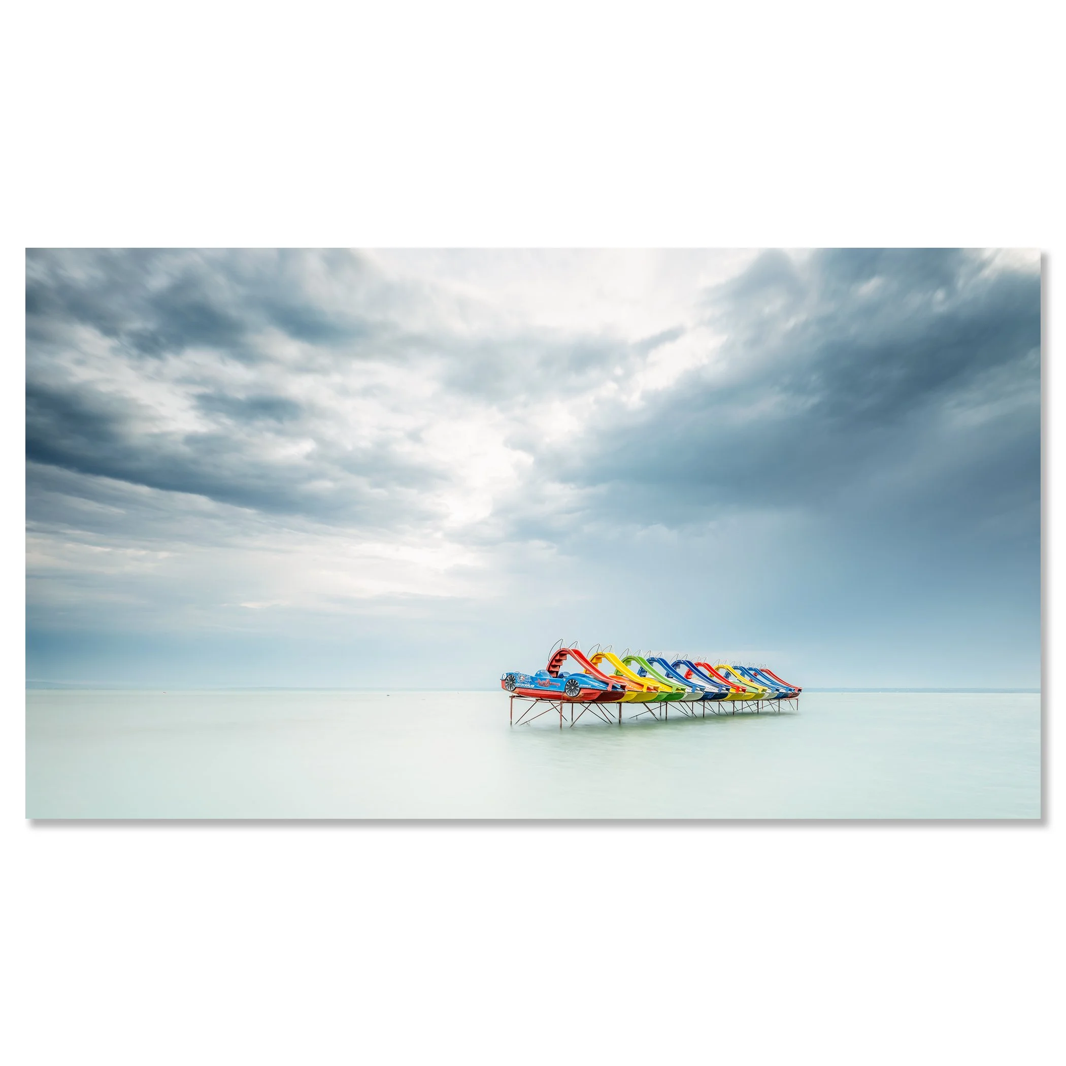 © 2021 Gerald Berghammer - Color panorama waterscape photography. A row of colorful pedal boats on the lake Balaton with dramatic cloudy sky. Chromaluxe frameless