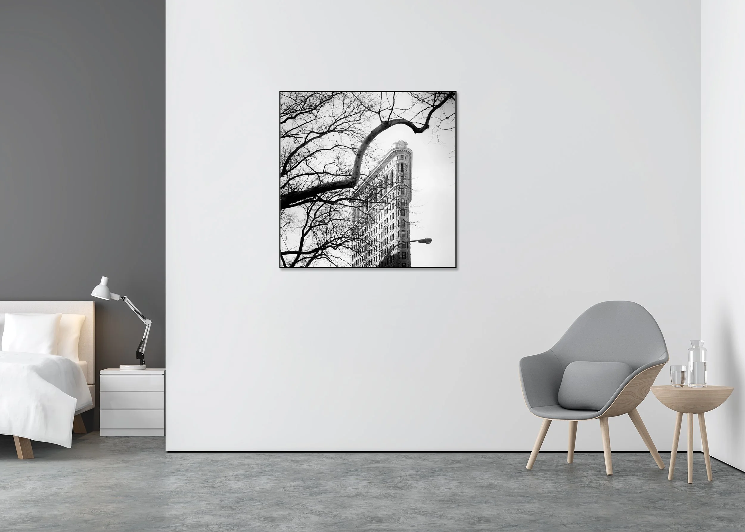 Flatiron Building Study 1 displayed in a modern interior as a black-and-white Dibond print in a black aluminium ArtBox frame by Gerald Berghammer.