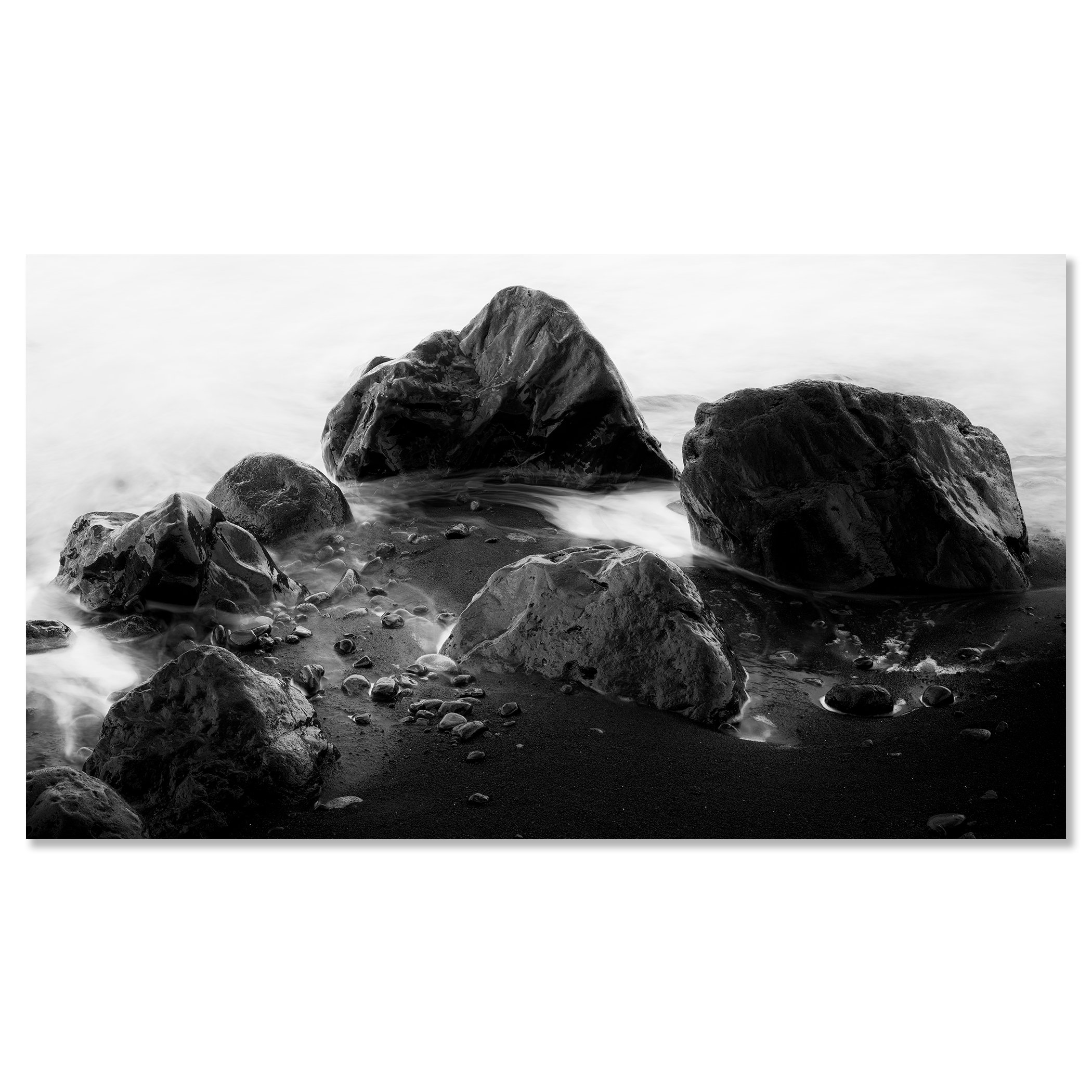 Black and white long exposure photo of sea rocks on a sandy beach with gentle surf – dibond frameless