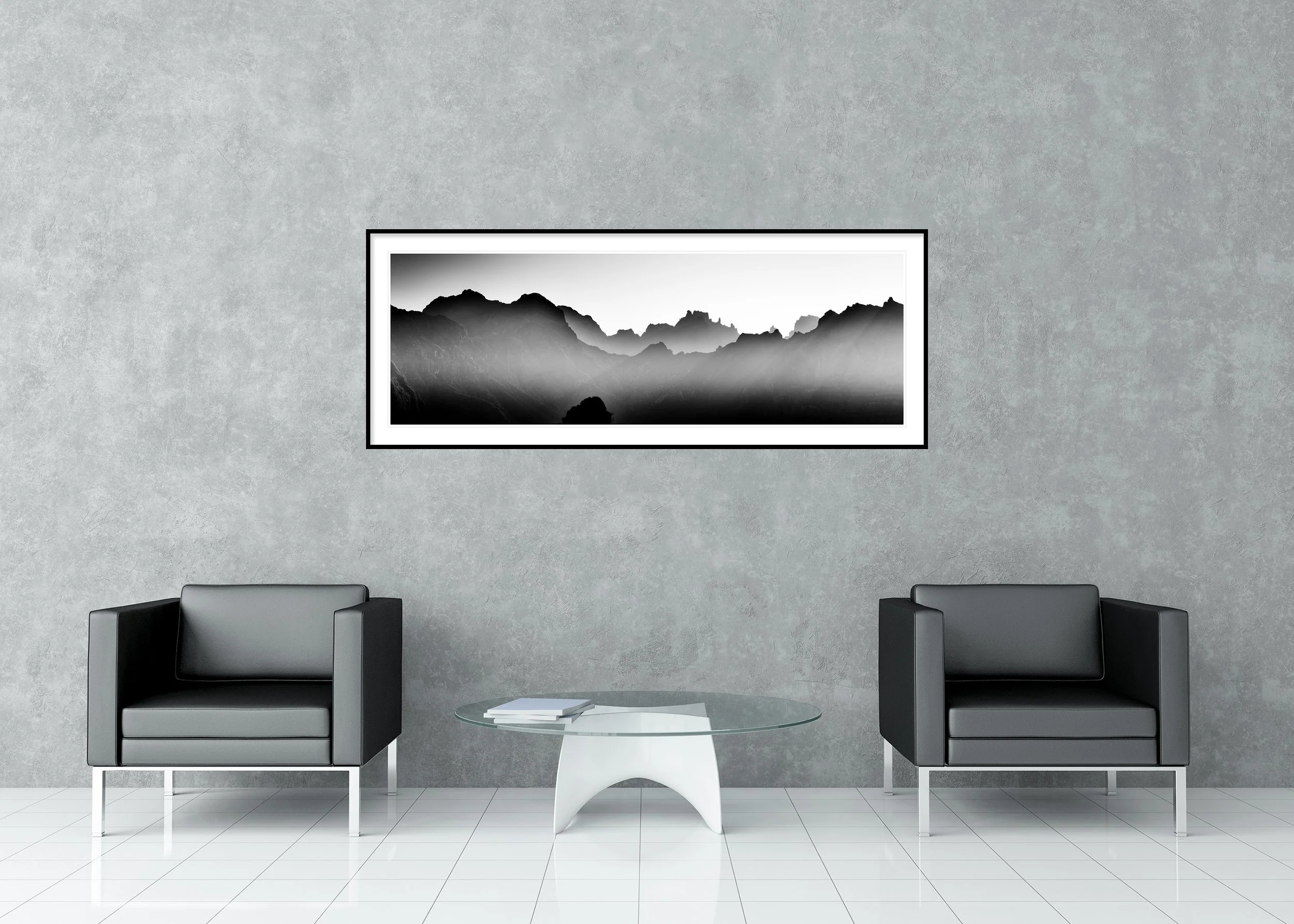 Mountains in Shadow with Morning Light displayed in a modern interior as an archival pigment print in a black aluminium frame with a white mount by Gerald Berghammer.