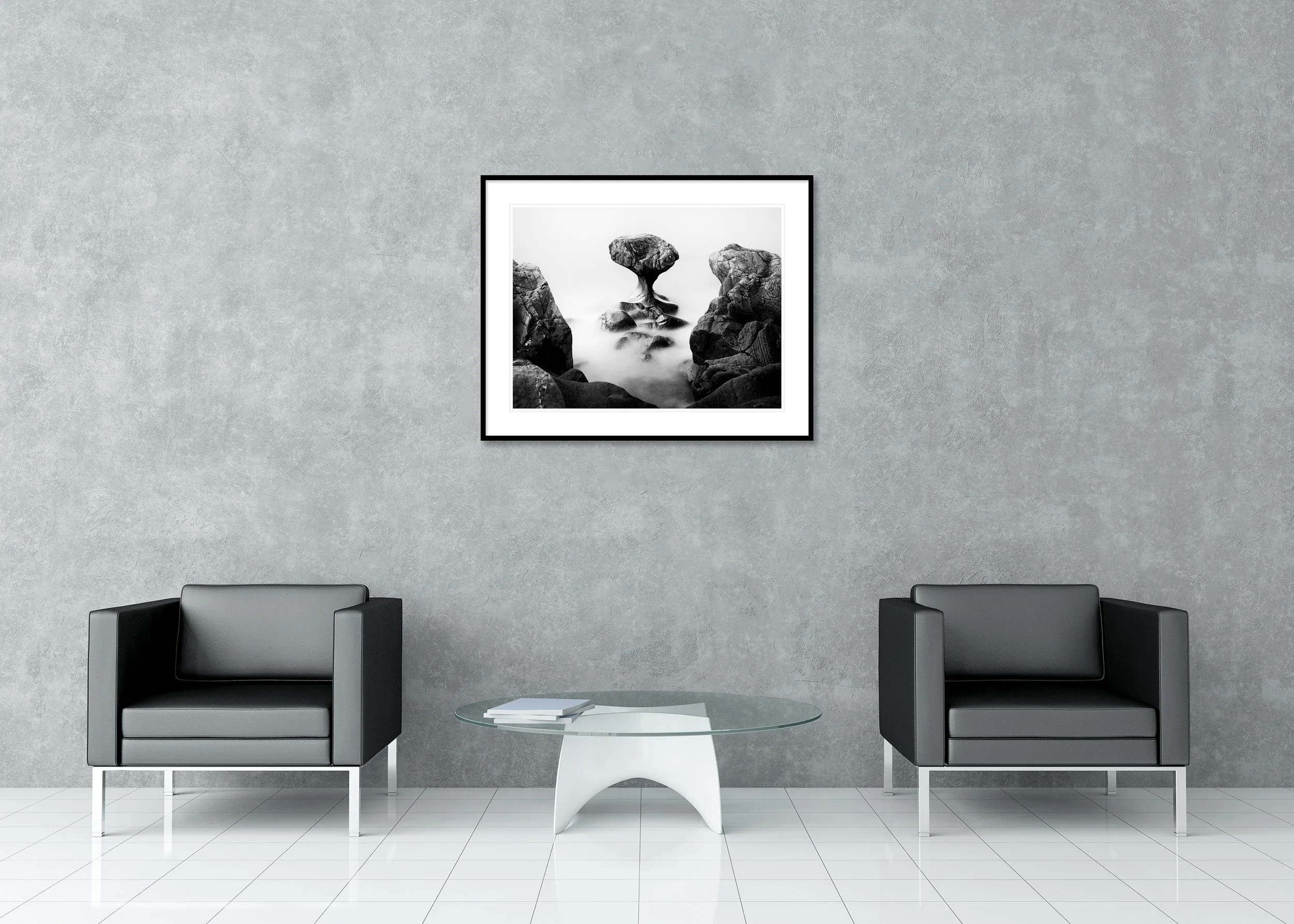 Balanced rock formation in water resembling a mushroom shape, black and white archival pigment print in a classic frame with a mount