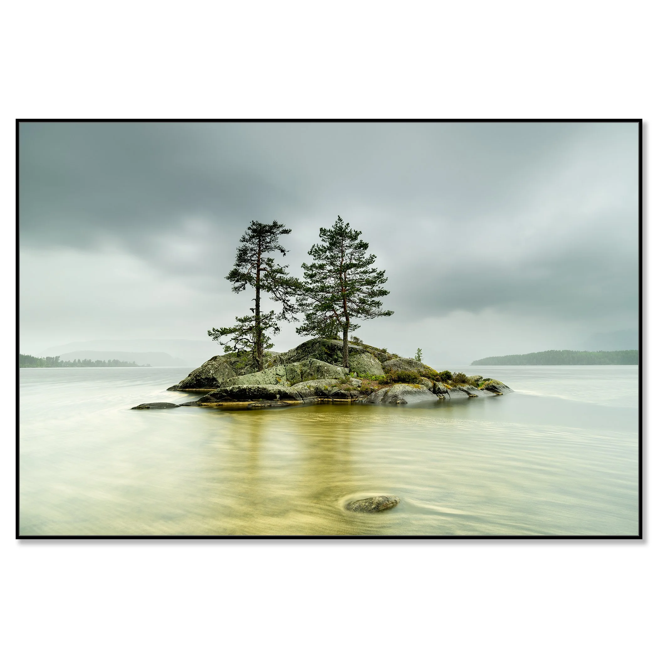 Two pine trees on a rocky island in a calm Norwegian lake under a cloudy sky – framed ArtBox black