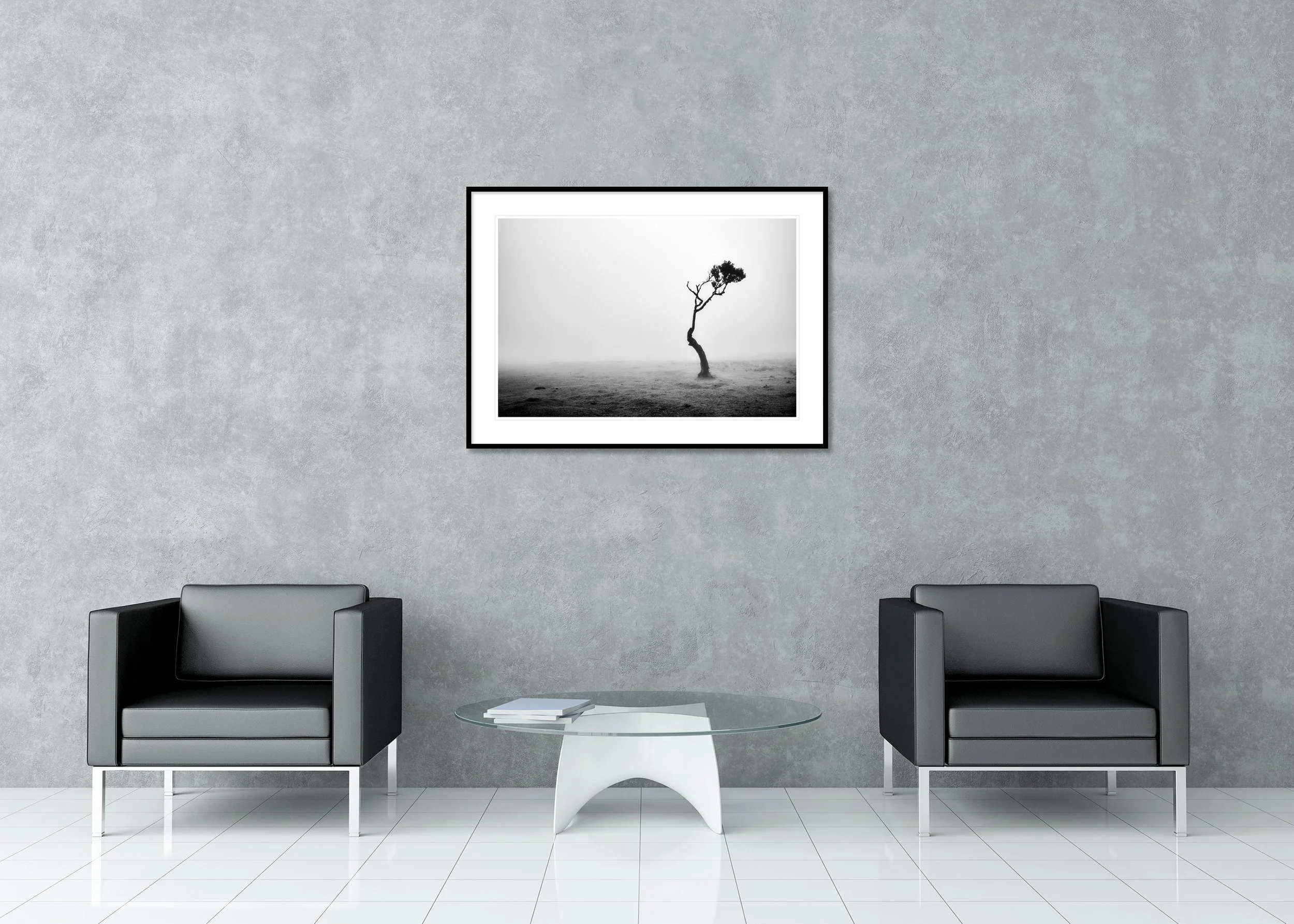 Lonely Tree in the Fog displayed in a modern interior as an archival pigment print in a black aluminium frame with white mount by Gerald Berghammer.