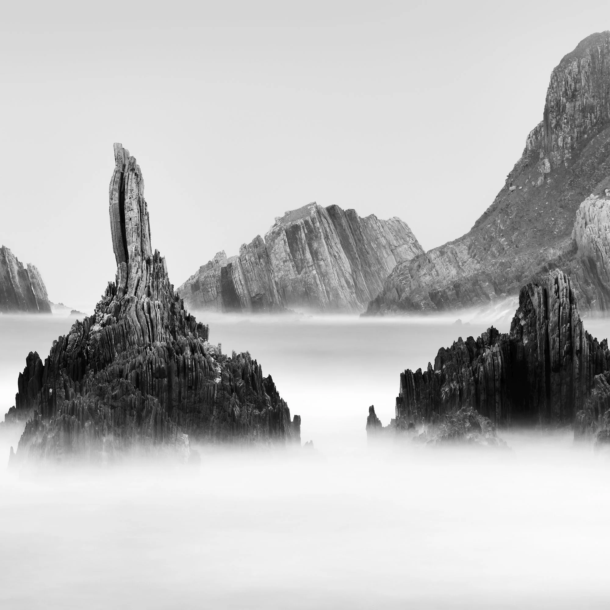 Detail of Rocky Peaks Panorama Study 5 by Gerald Berghammer showing sculptural coastal rocks and long-exposure water in Spain.