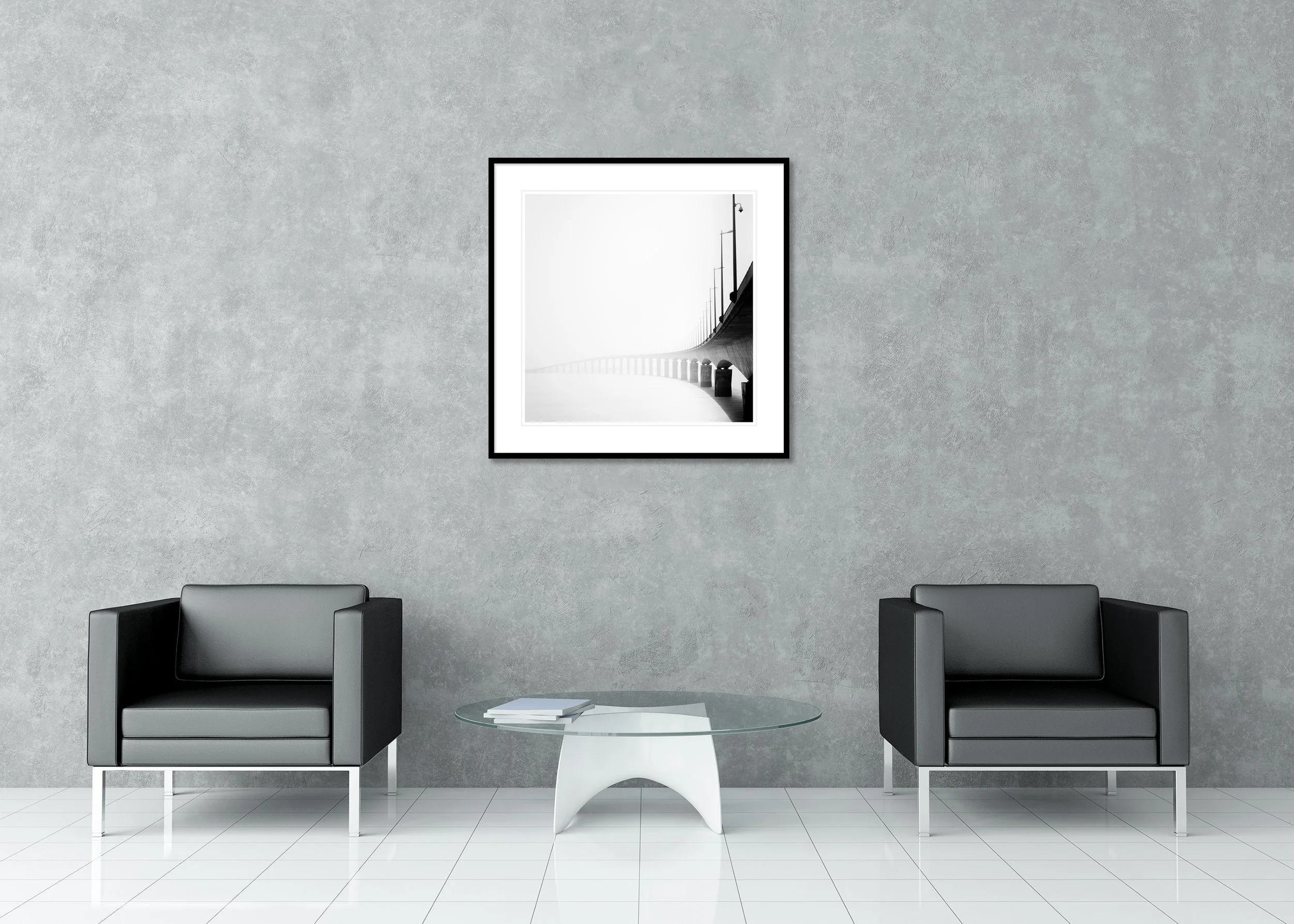 Pont de l’Île de Ré Study 1 displayed in a modern interior as an archival pigment print in a black aluminium frame with a white mount by Gerald Berghammer.