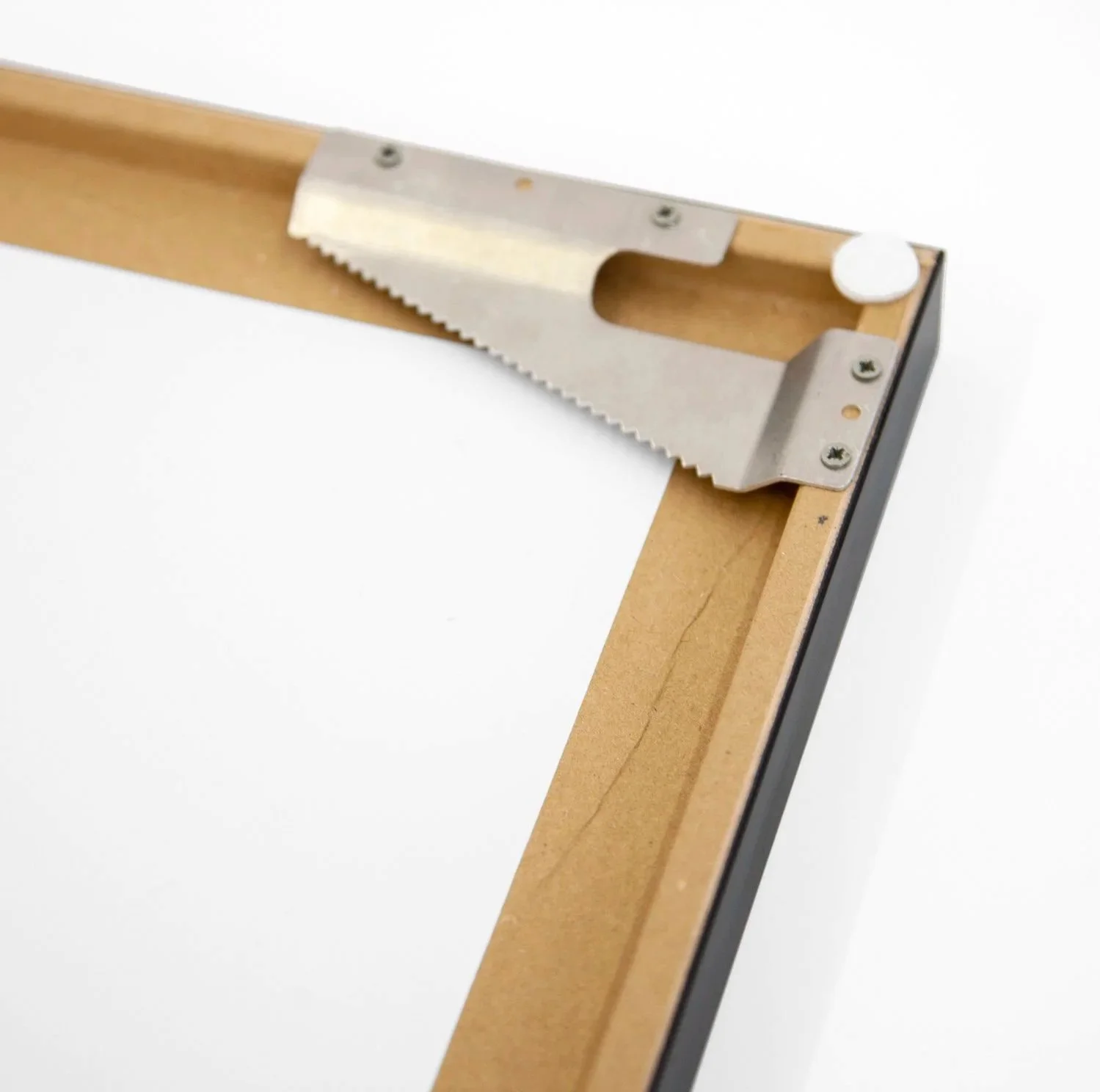 Rear corner detail of Gerald Berghammer's framed photograph, showing the wooden frame construction and metal fitting.