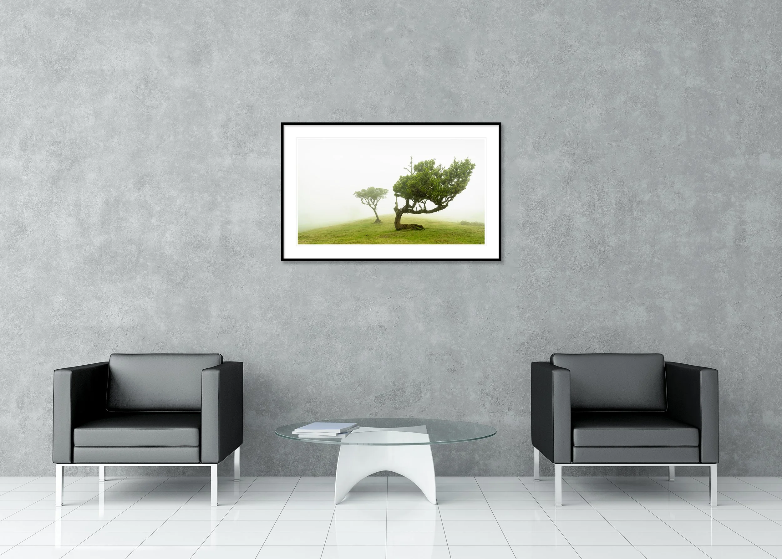Two wind-bent trees on a green hillside in dense fog, peaceful landscape archival pigment print in a classic frame with mount.
