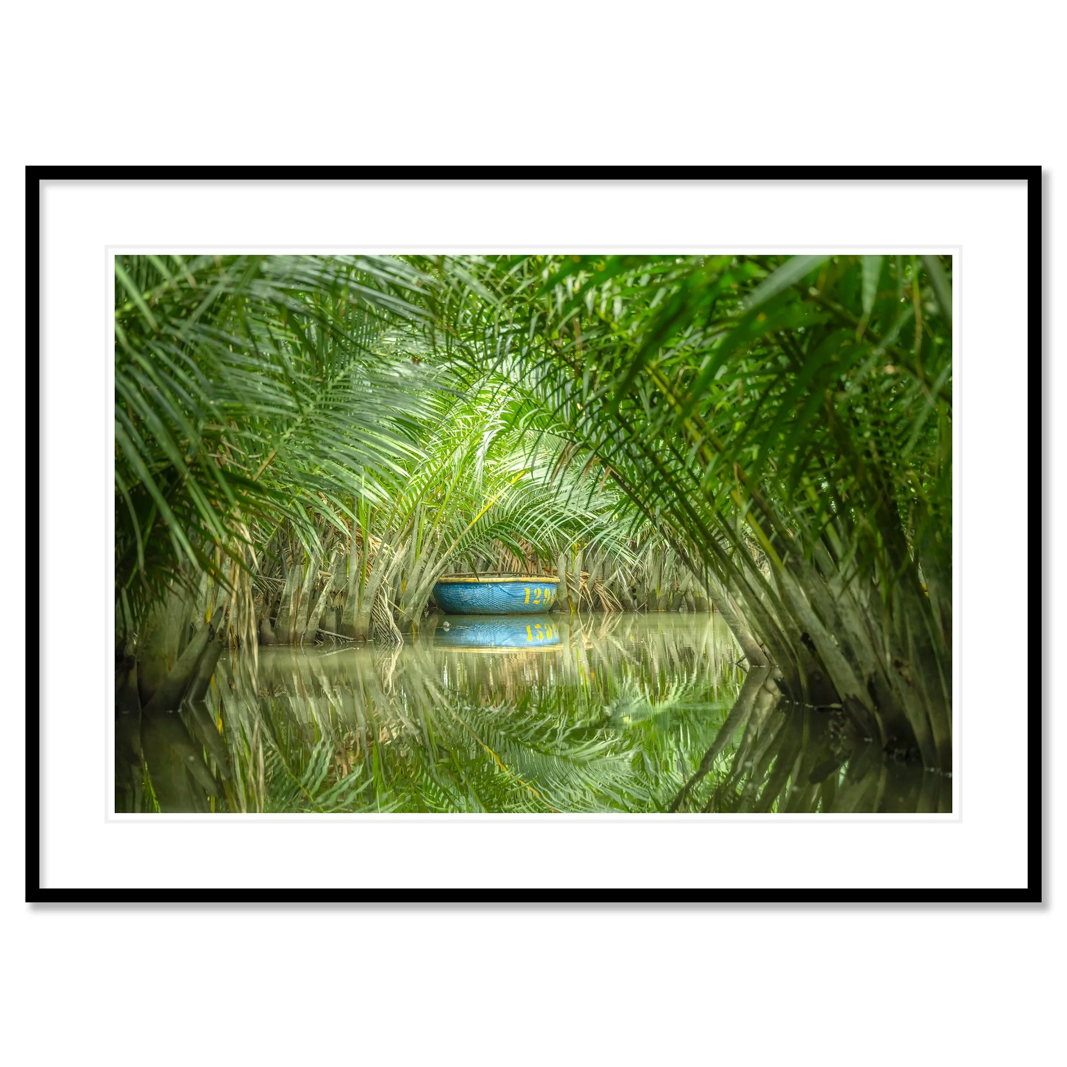 © 2025 Gerald Berghammer - Color waterscape photography. A small coconut boat among dense green nipa palm trees on a calm water body, with its reflection visible. Classic framed black