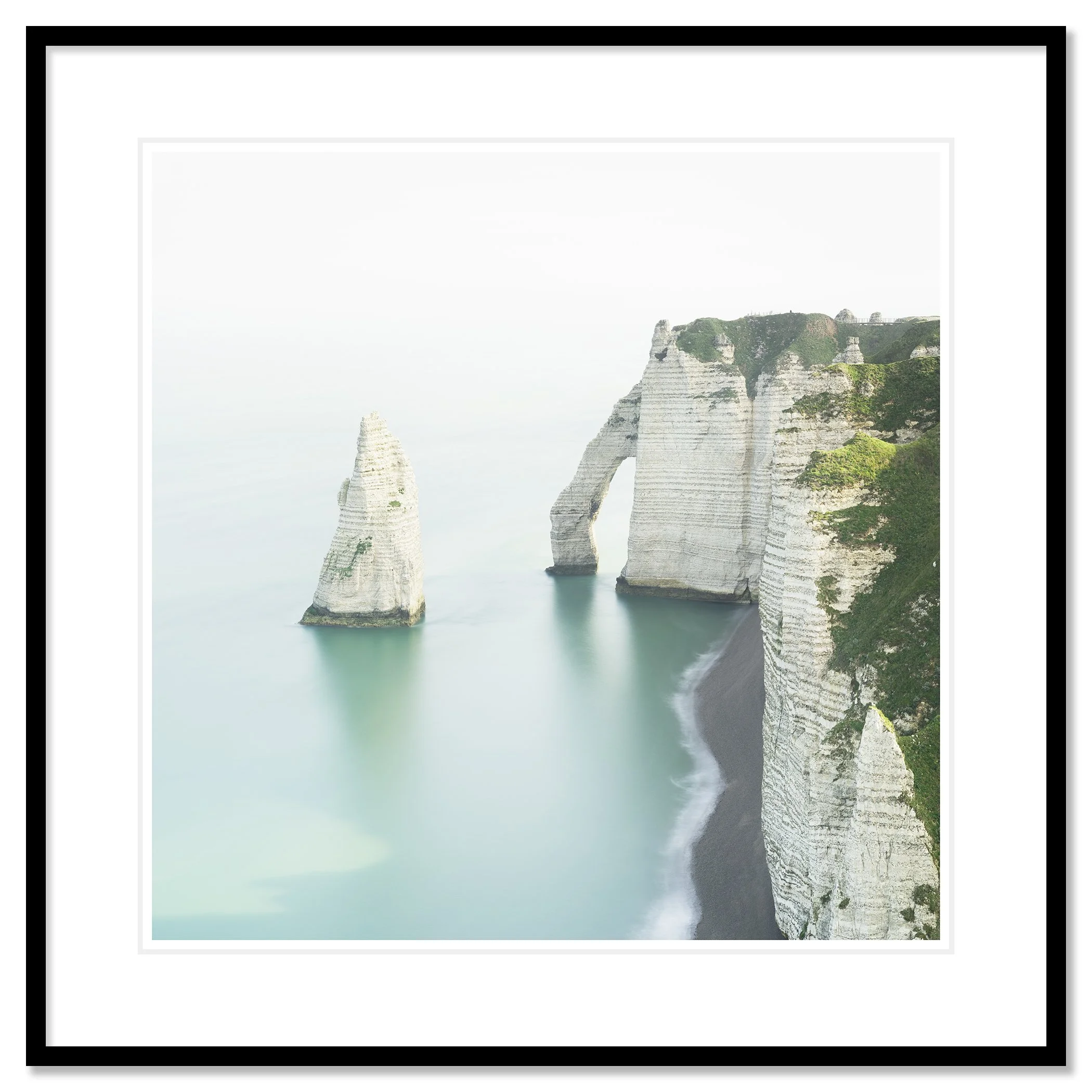 Archival pigment print of The White Cliffs of Étretat in a black aluminium frame with white mount