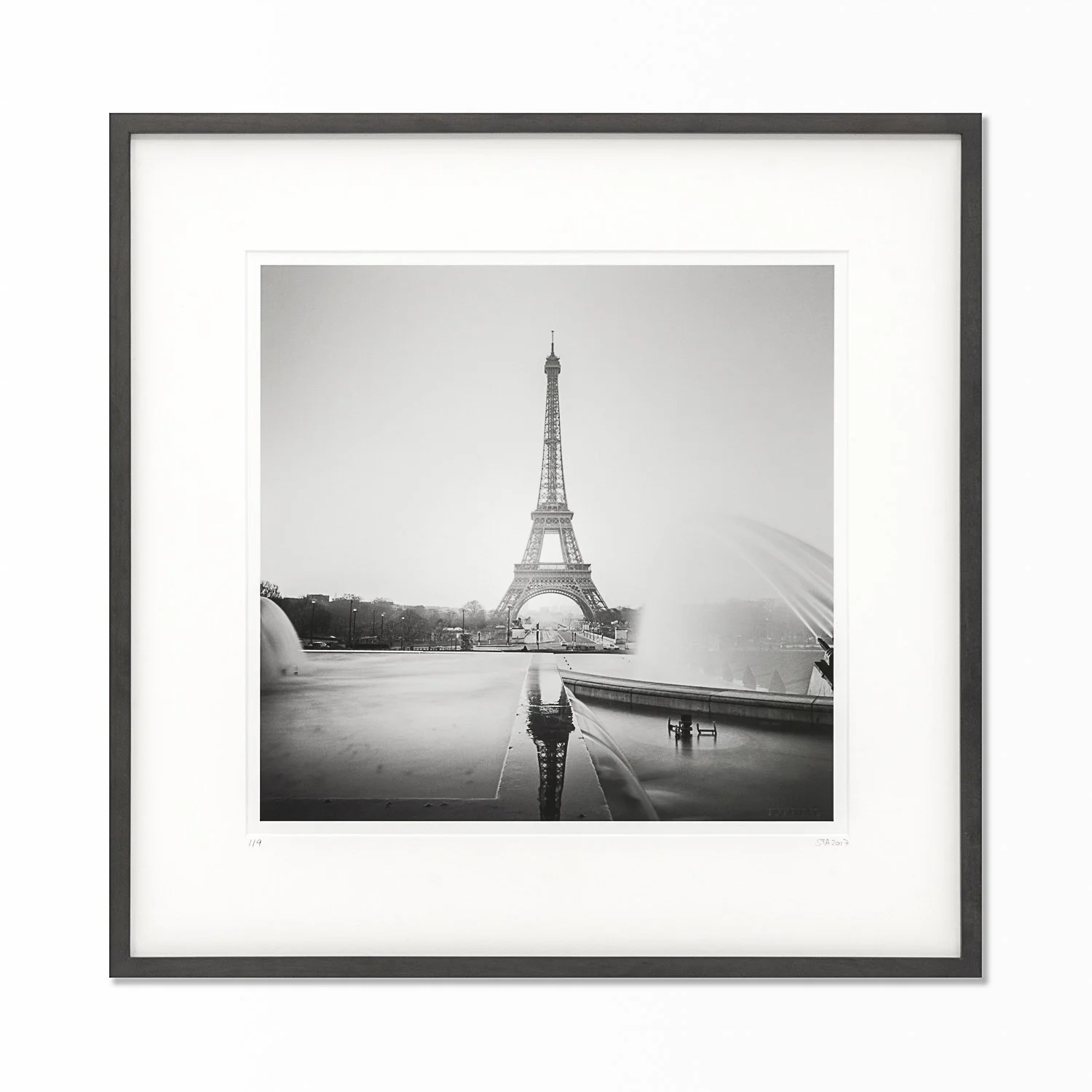 Framed black-and-white fine art photograph Eiffel Tower Study 1, Paris, France, by Gerald Berghammer. Gelatin silver print with black wooden frame and natural-white archival mount.
