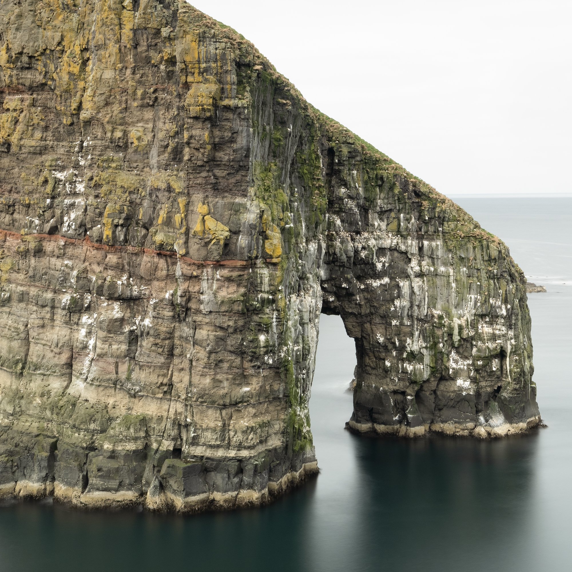 Gerald Berghammer - Color seascape panorama photography. Cliffs and sea stacks along a coastline under an overcast sky. Print detail 3